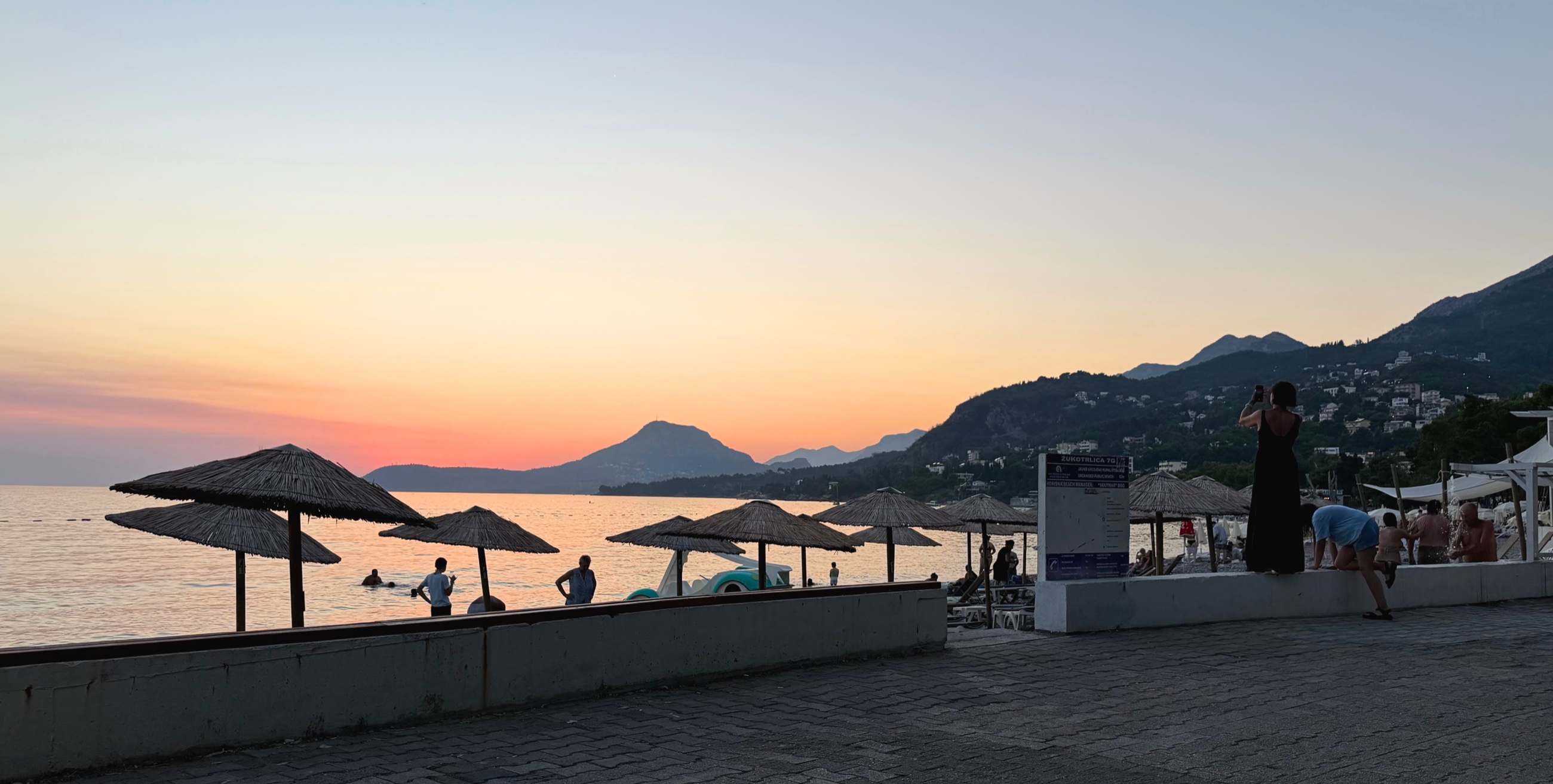 Sunset over Šušanj Beach and its promenade.