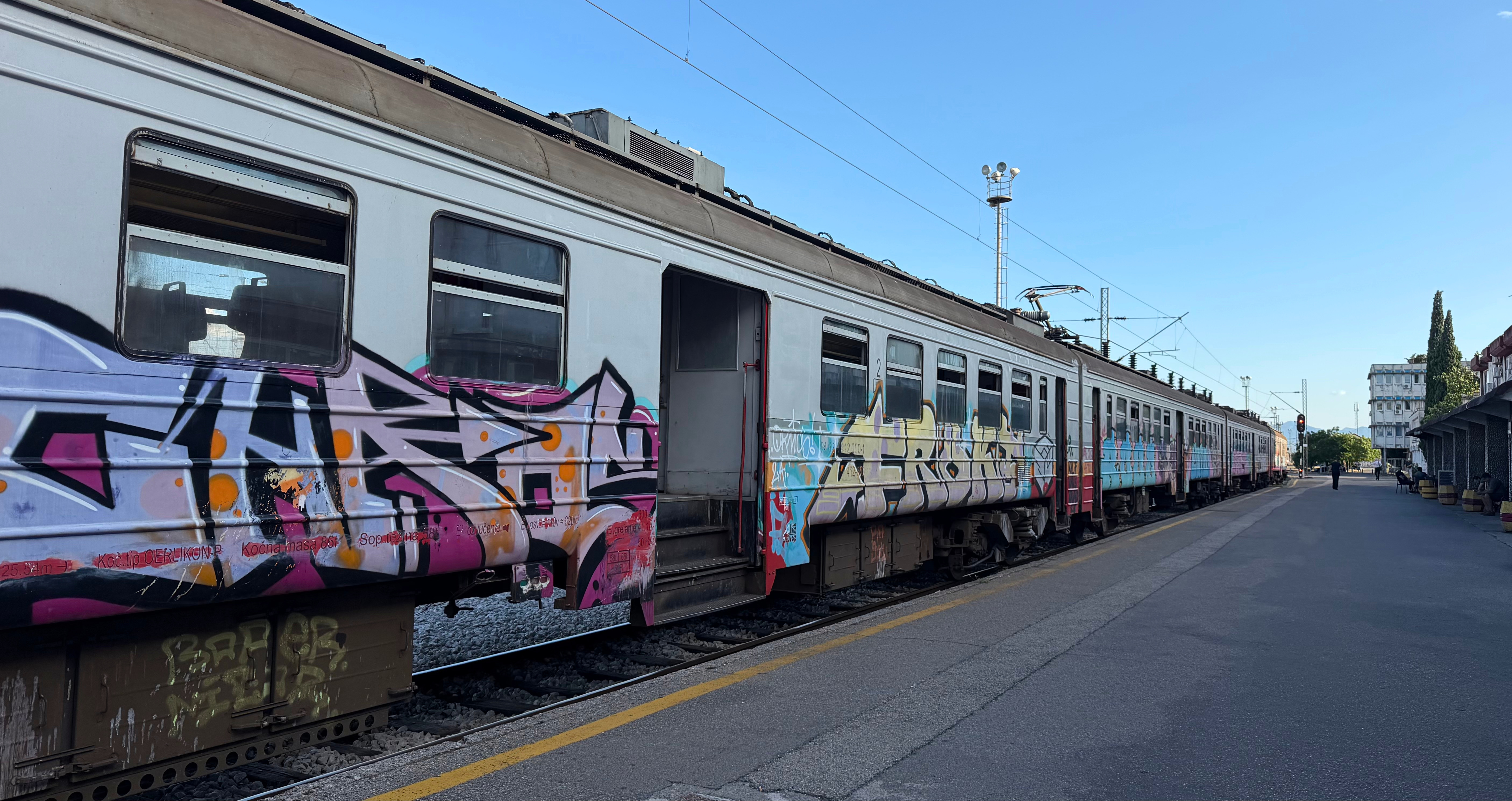 A Yugoslav-era train from Bar to Podgorica, weathered, graffitied, and still connecting the coast to the capital.