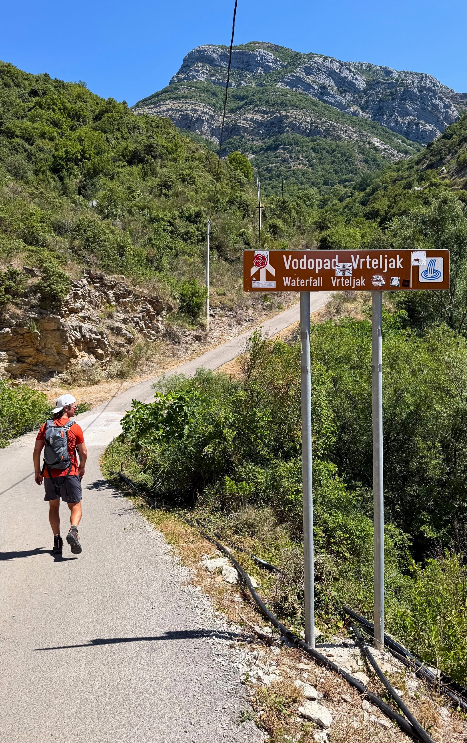 The paved mountain road climbing toward Vrteljak waterfall above Stari Bar