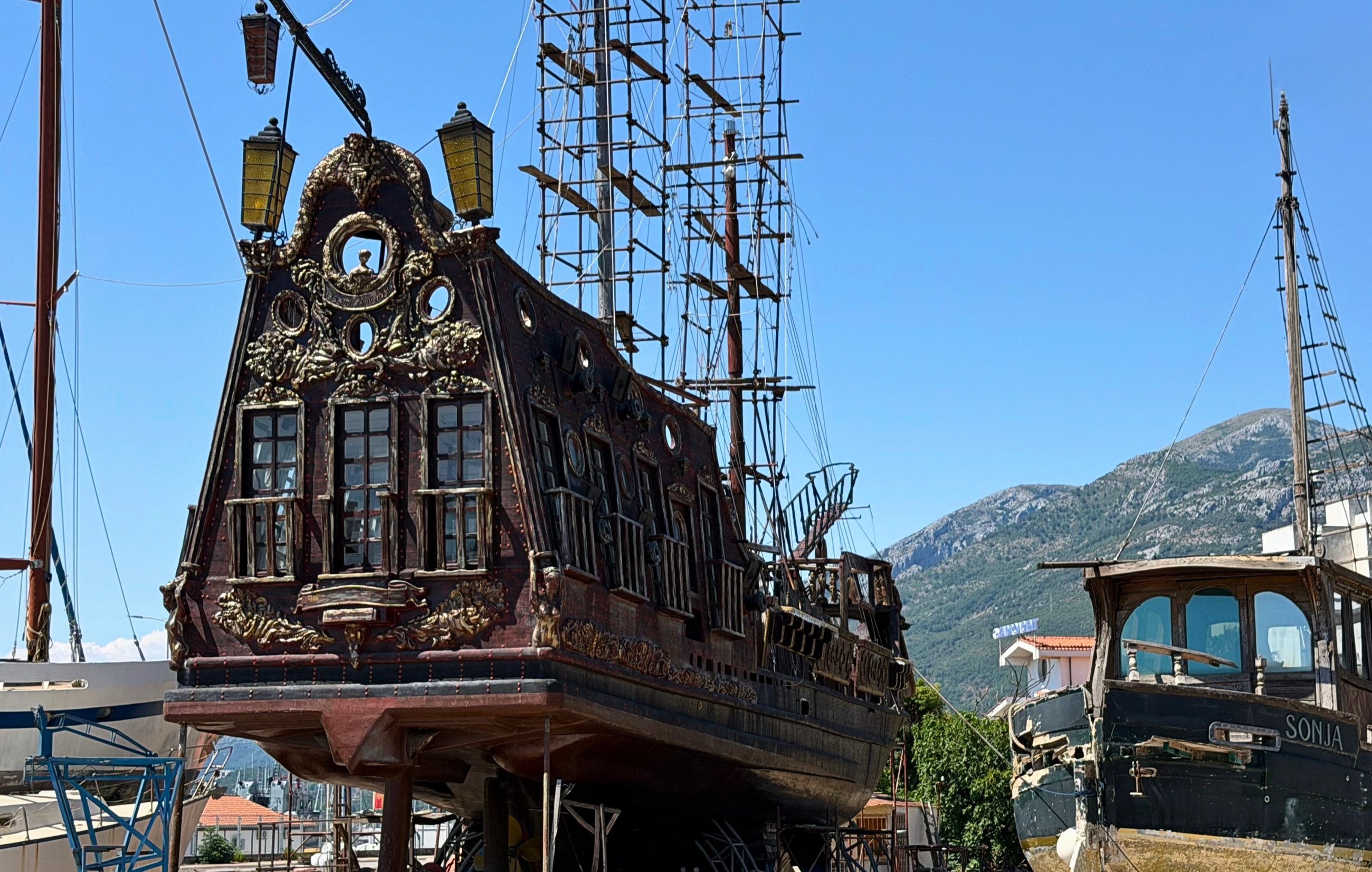 A large ornate wooden vessel under repair in Bar’s shipyard