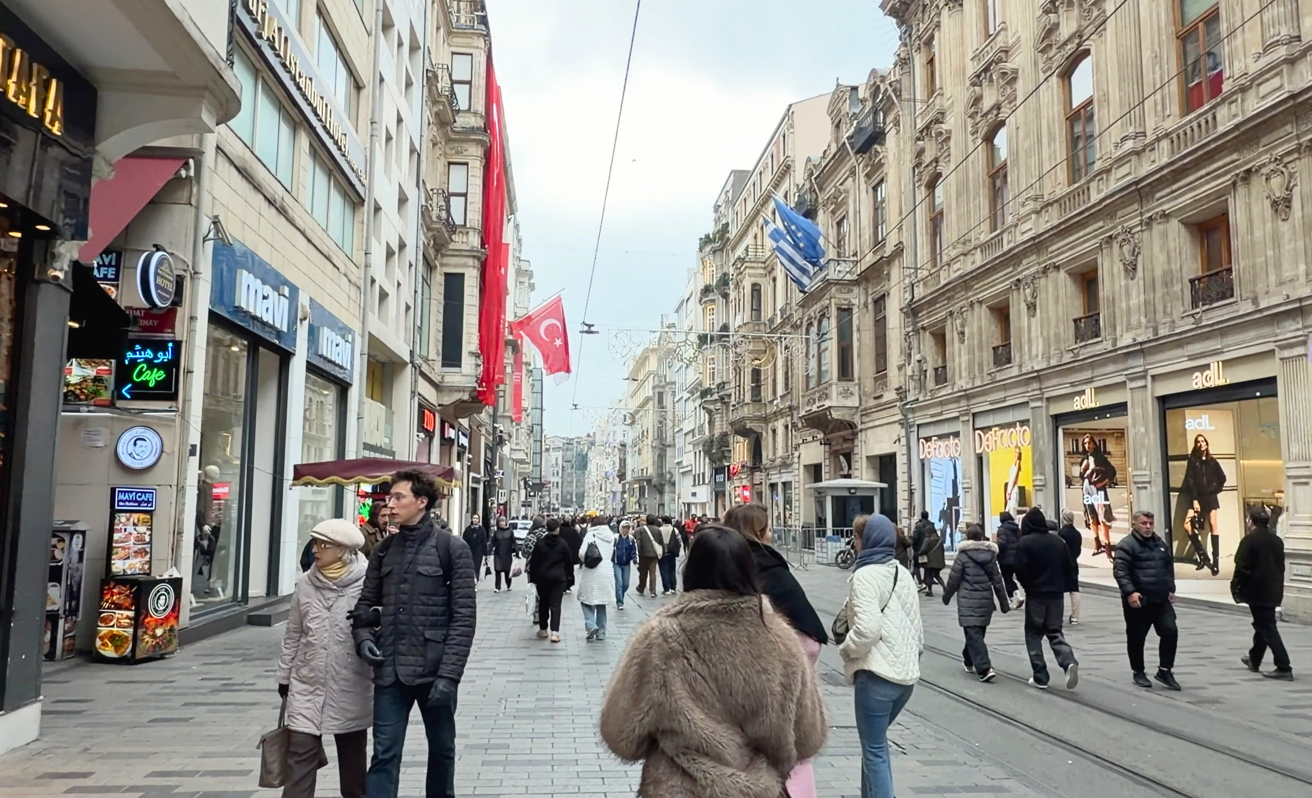 People walking along Istiklal Avenue in Istanbul.