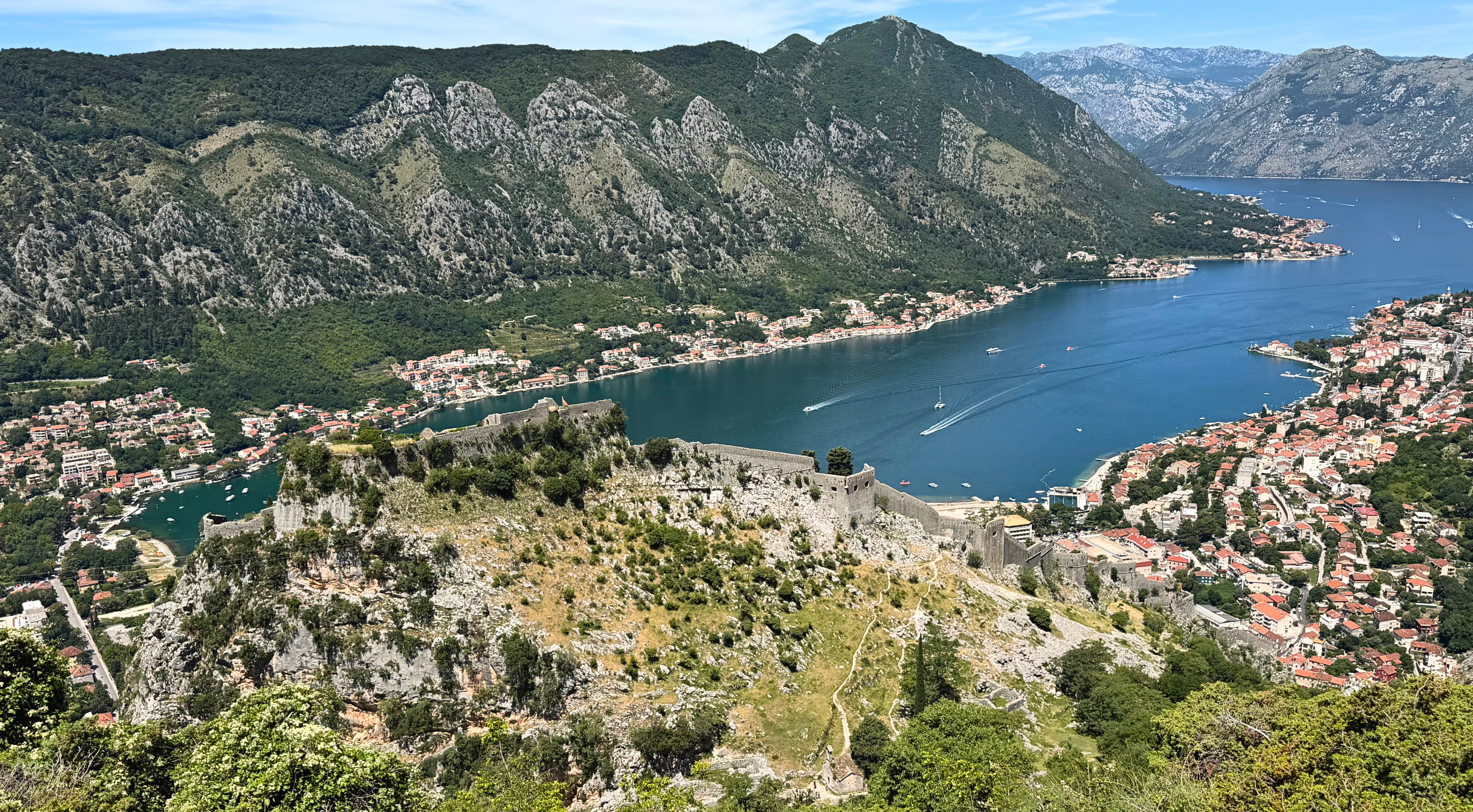St. John's Fortress and its walls climbing the mountain above the Old Town and the bay.
