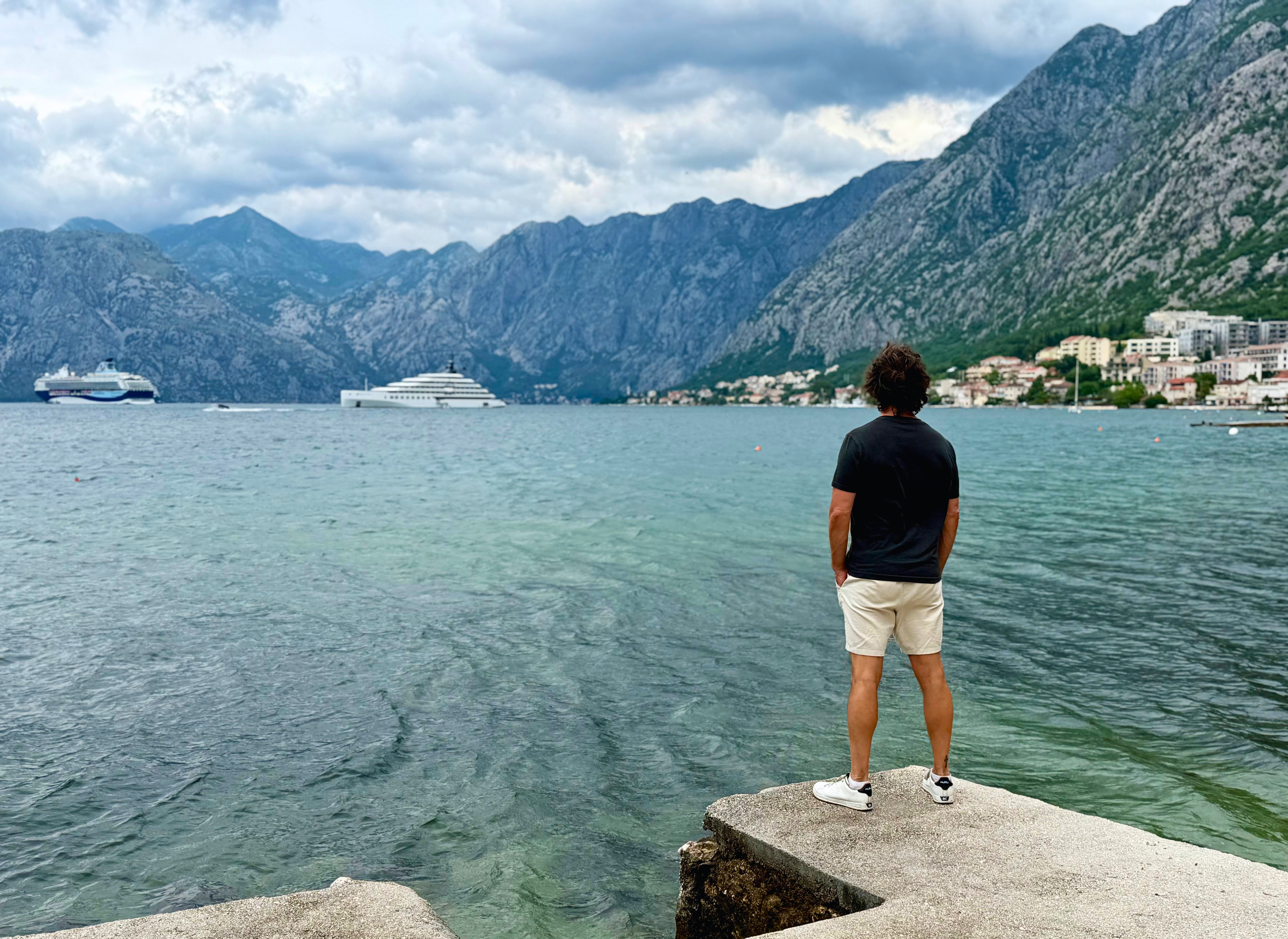 The Bay of Kotor from Dobrota with clouds rolling over the mountains.