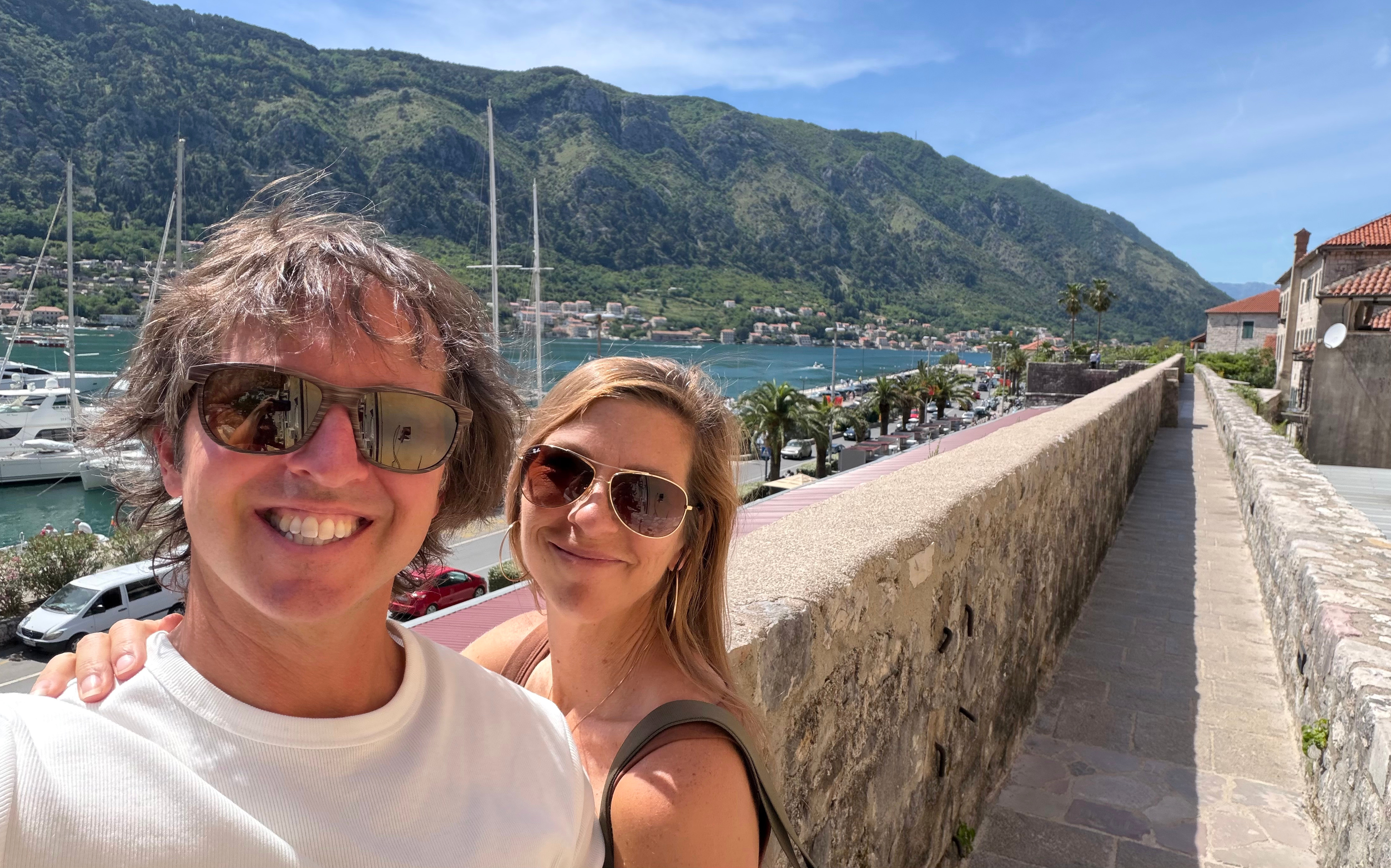 Sam and Stephanie on the walls of Old Kotor with the bay behind them.