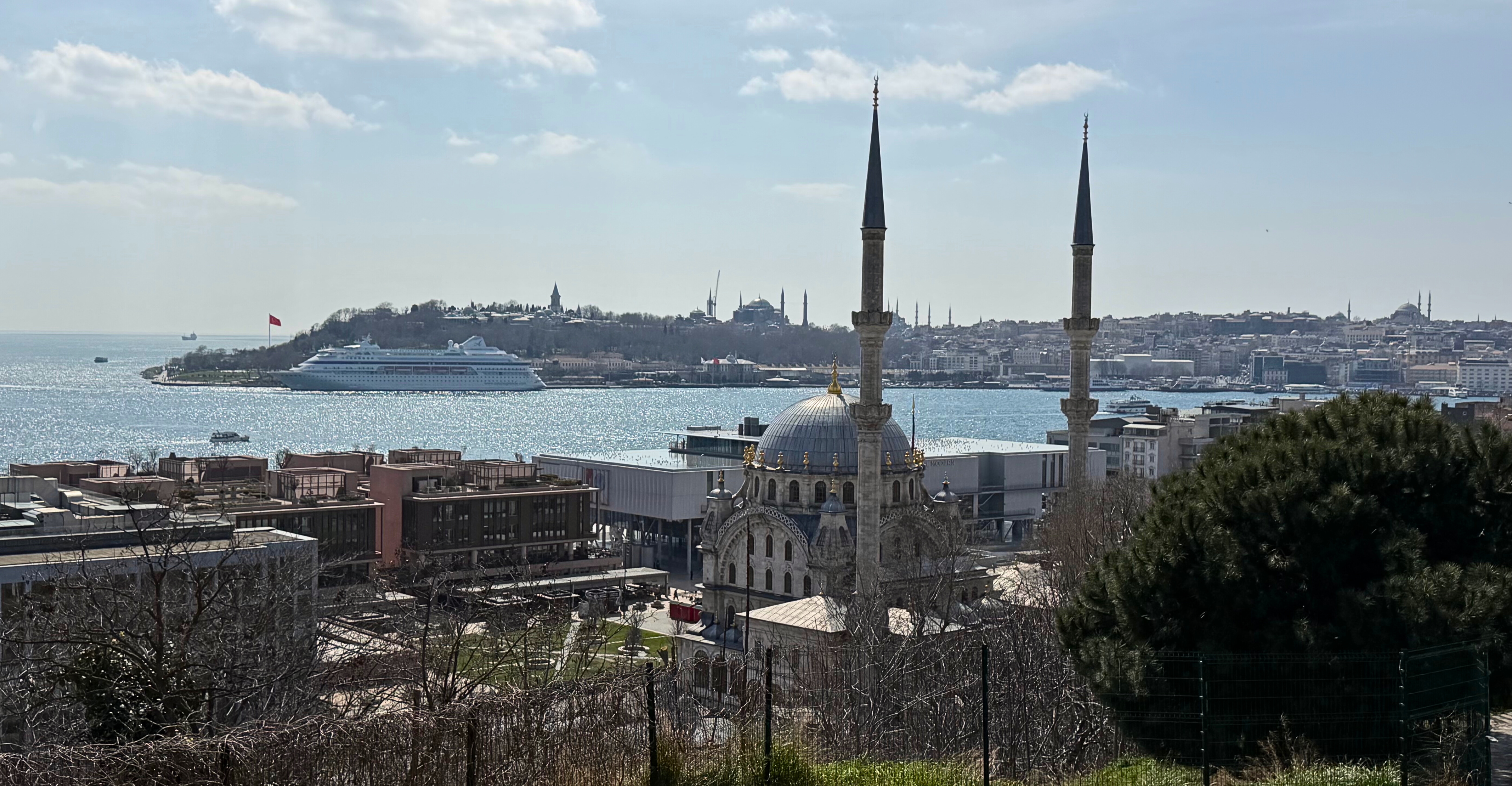 A view of Istanbul with water, rooftops, and the city stretching toward the horizon.
