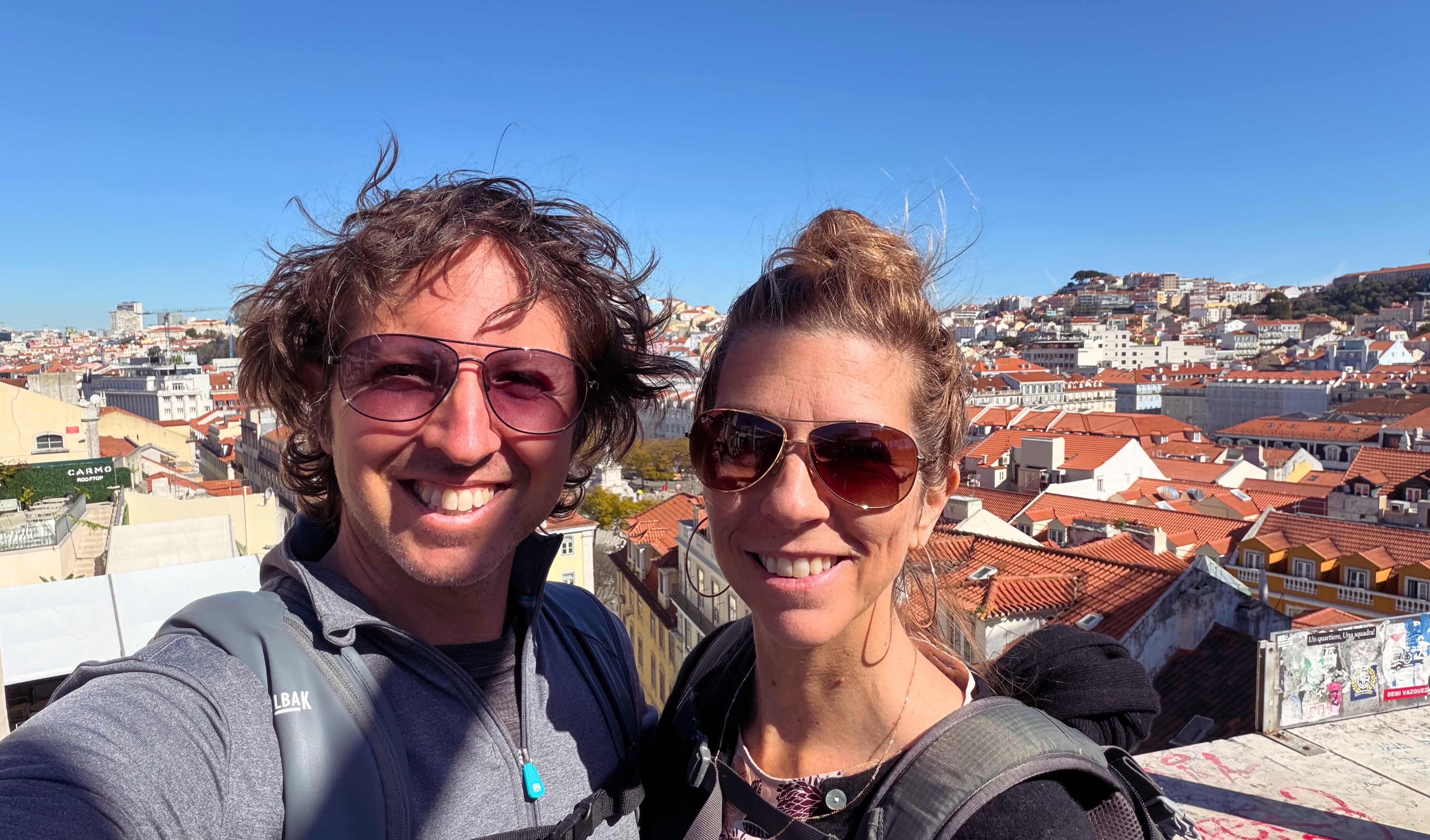 Sam and Stephanie in Lisbon with the city behind them.