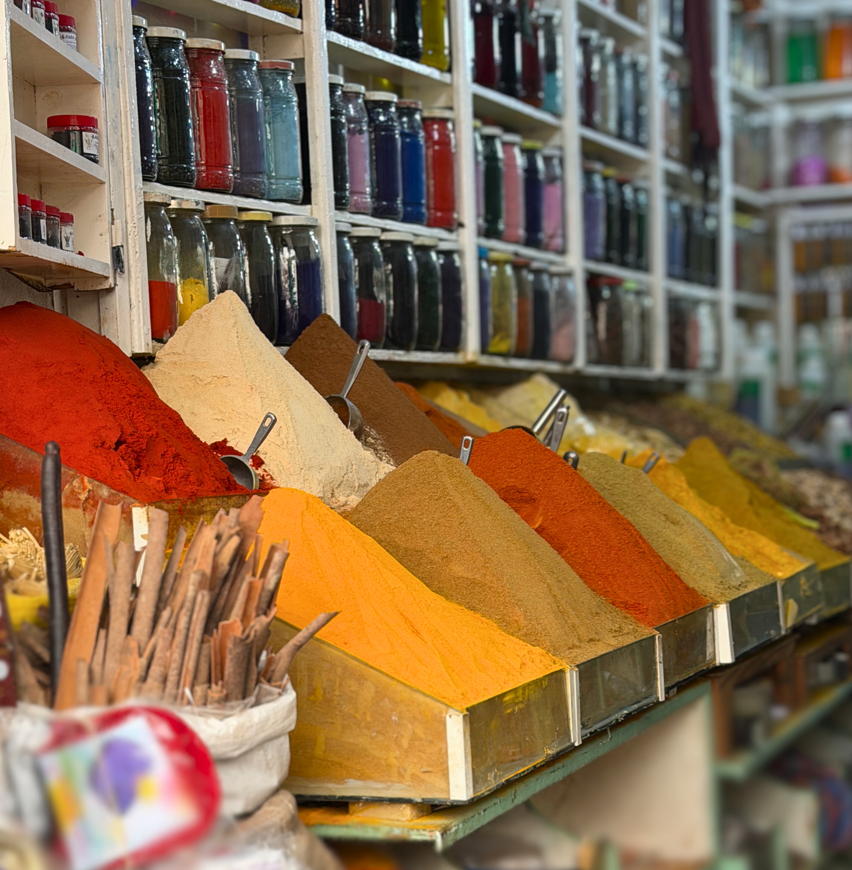 Colorful spice pyramids displayed in the Marrakesh souks.