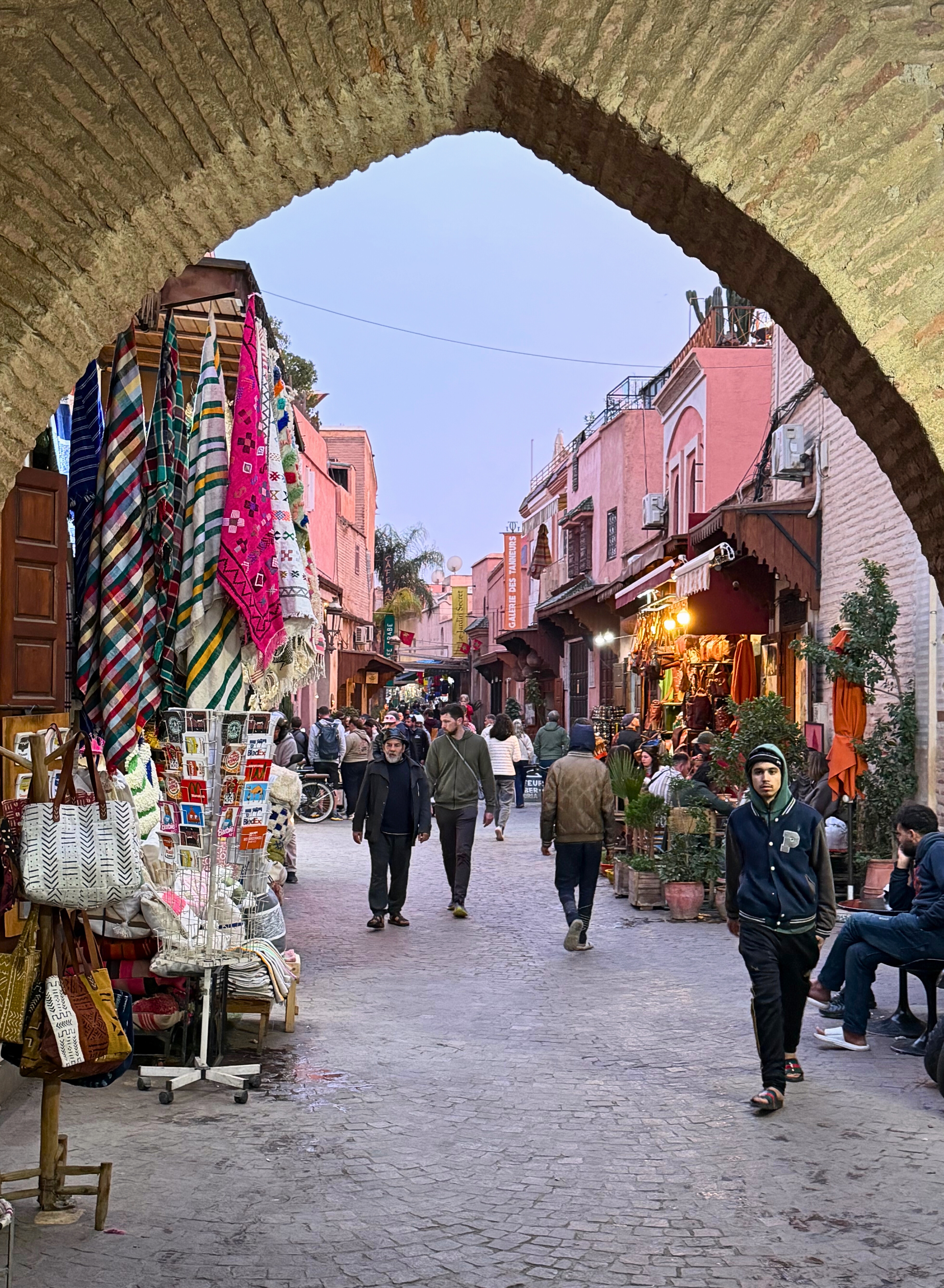 A narrow medina lane in Marrakesh in the evening.