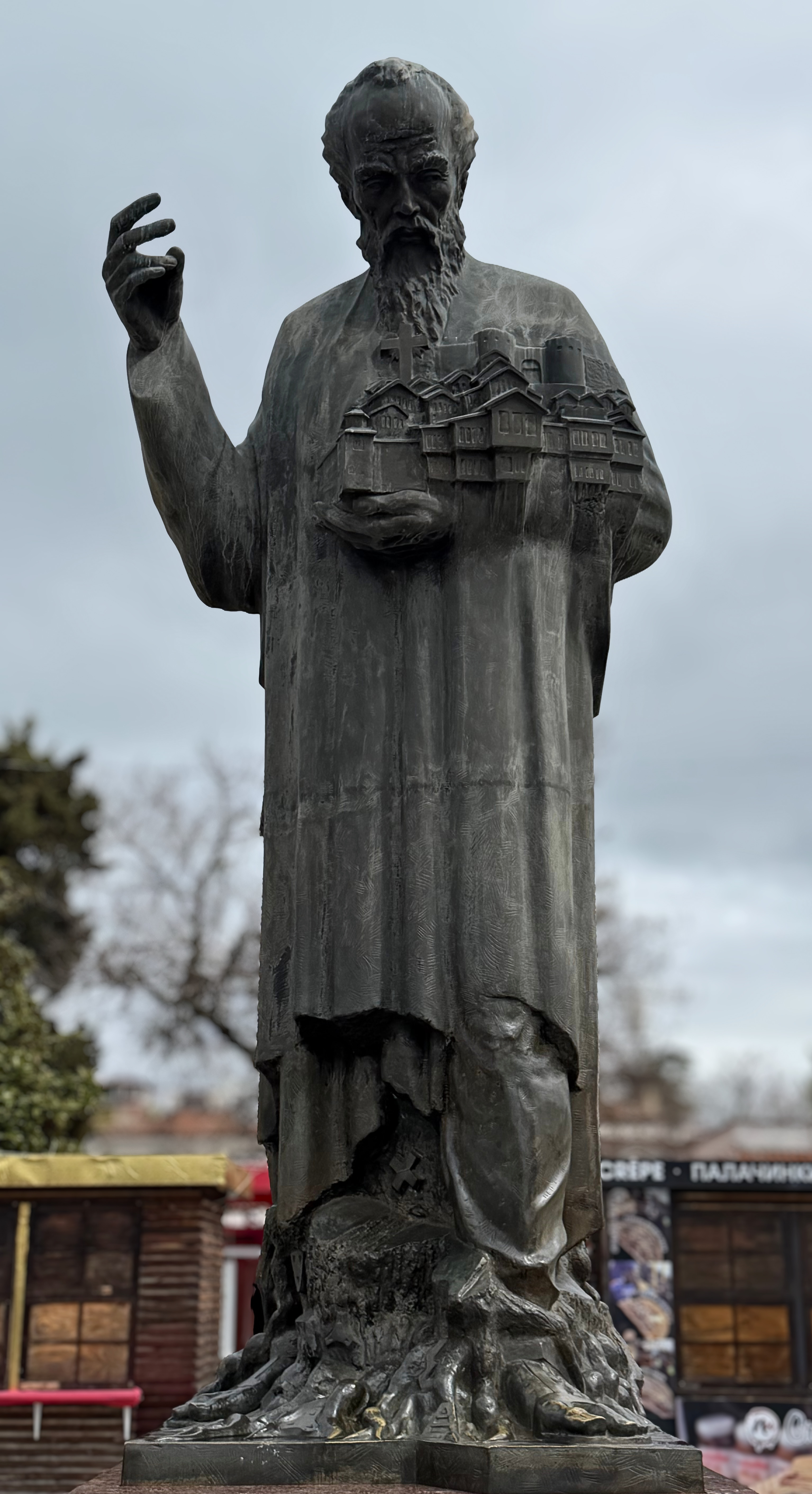 A statue of Saint Clement of Ohrid holding a model of the city.