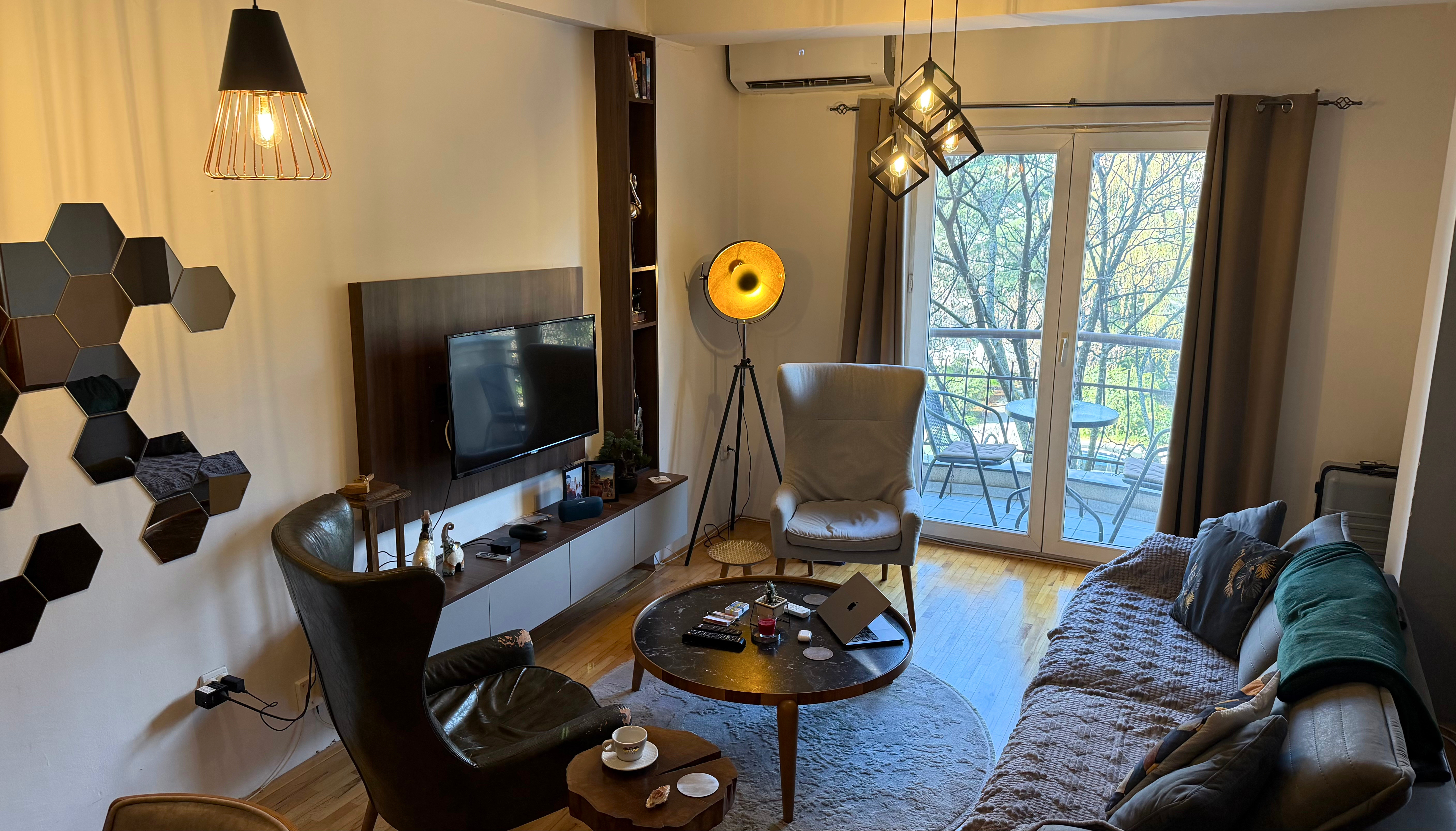 Interior of the Ohrid apartment with a comfortable living area and work-friendly setup.