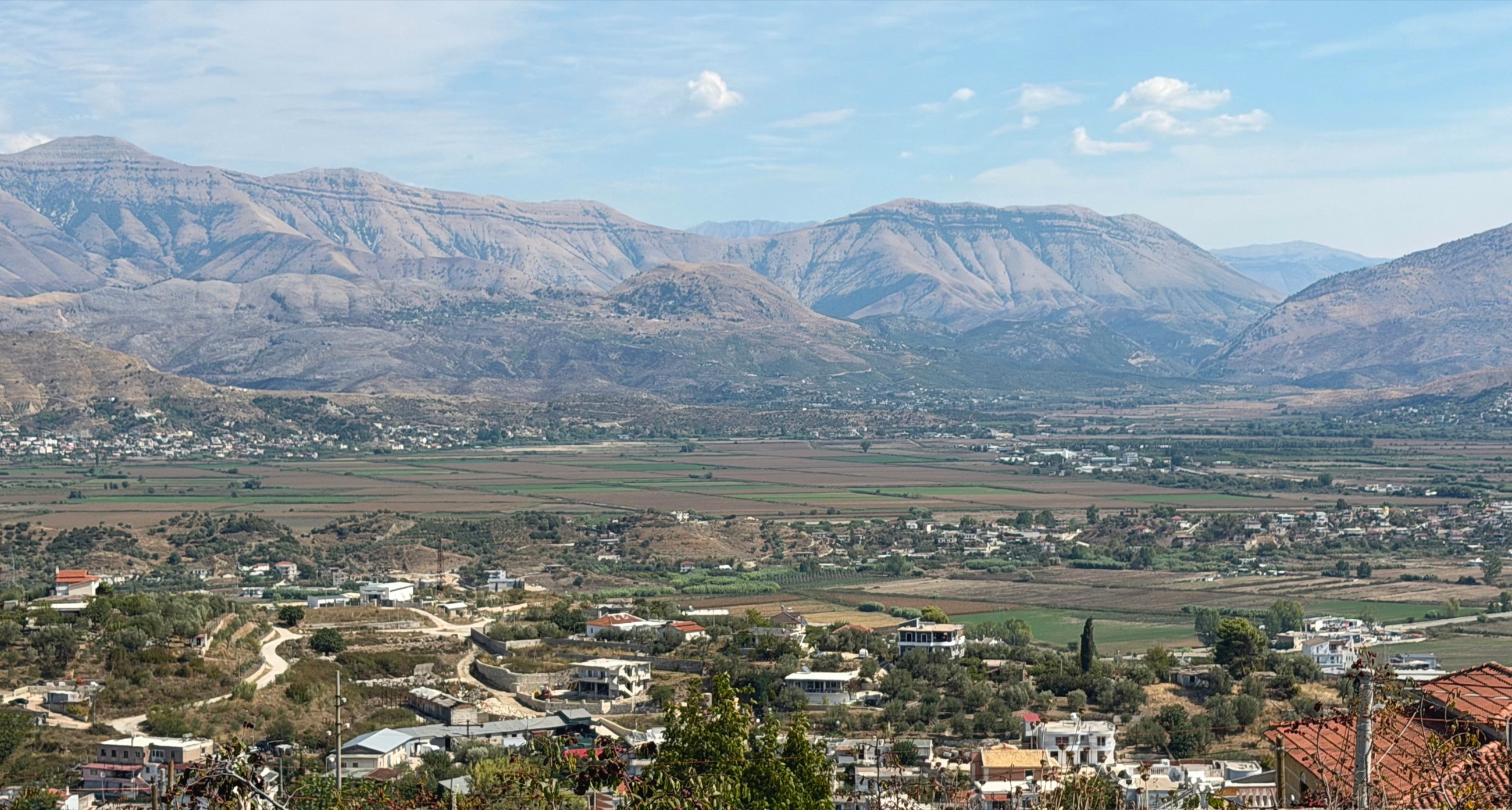 The Gjashtë valley and mountains viewed from the inland side of the monastery ridge.