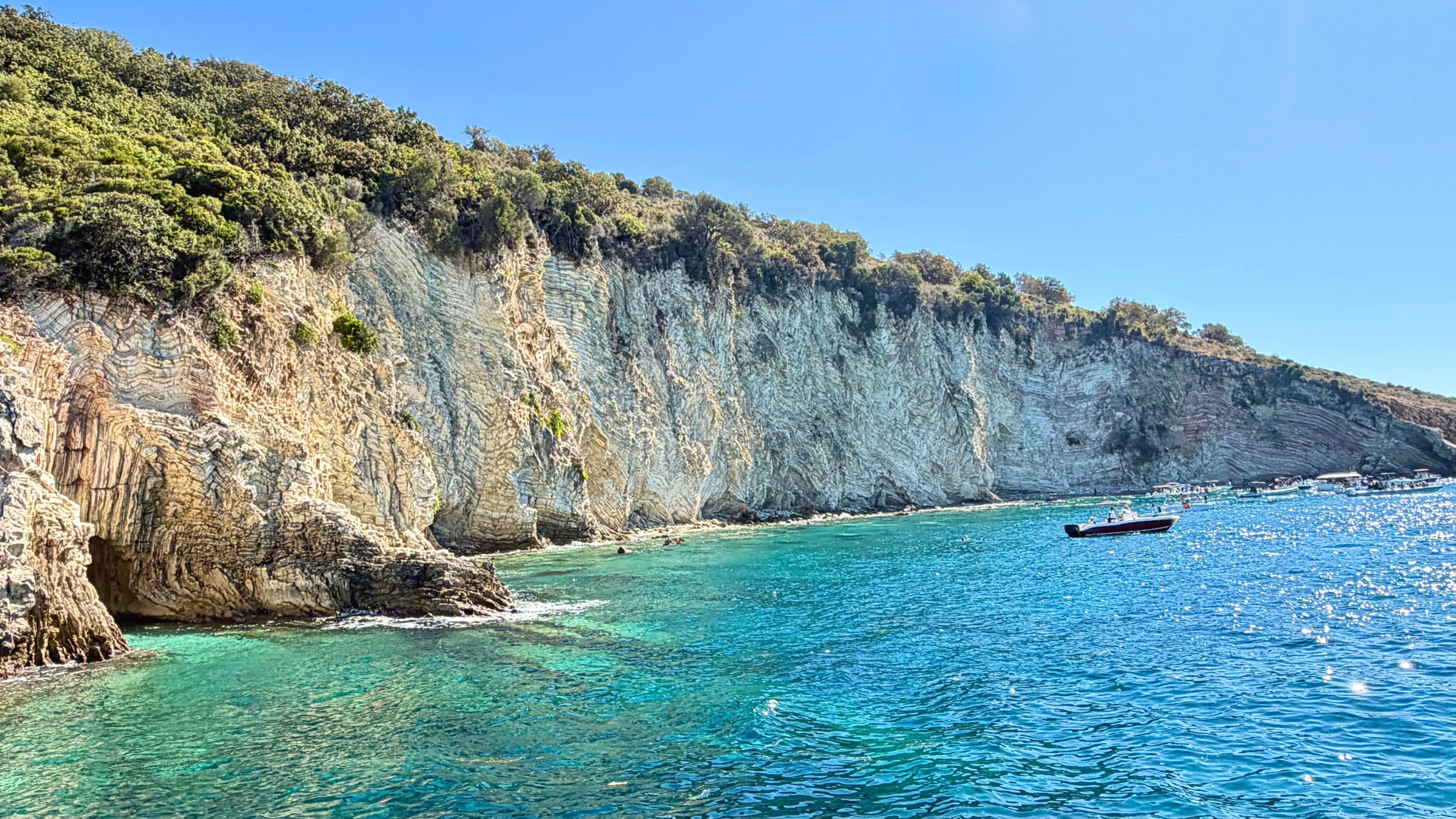 Pale limestone cliffs above the blue Ionian Sea at Gremina.