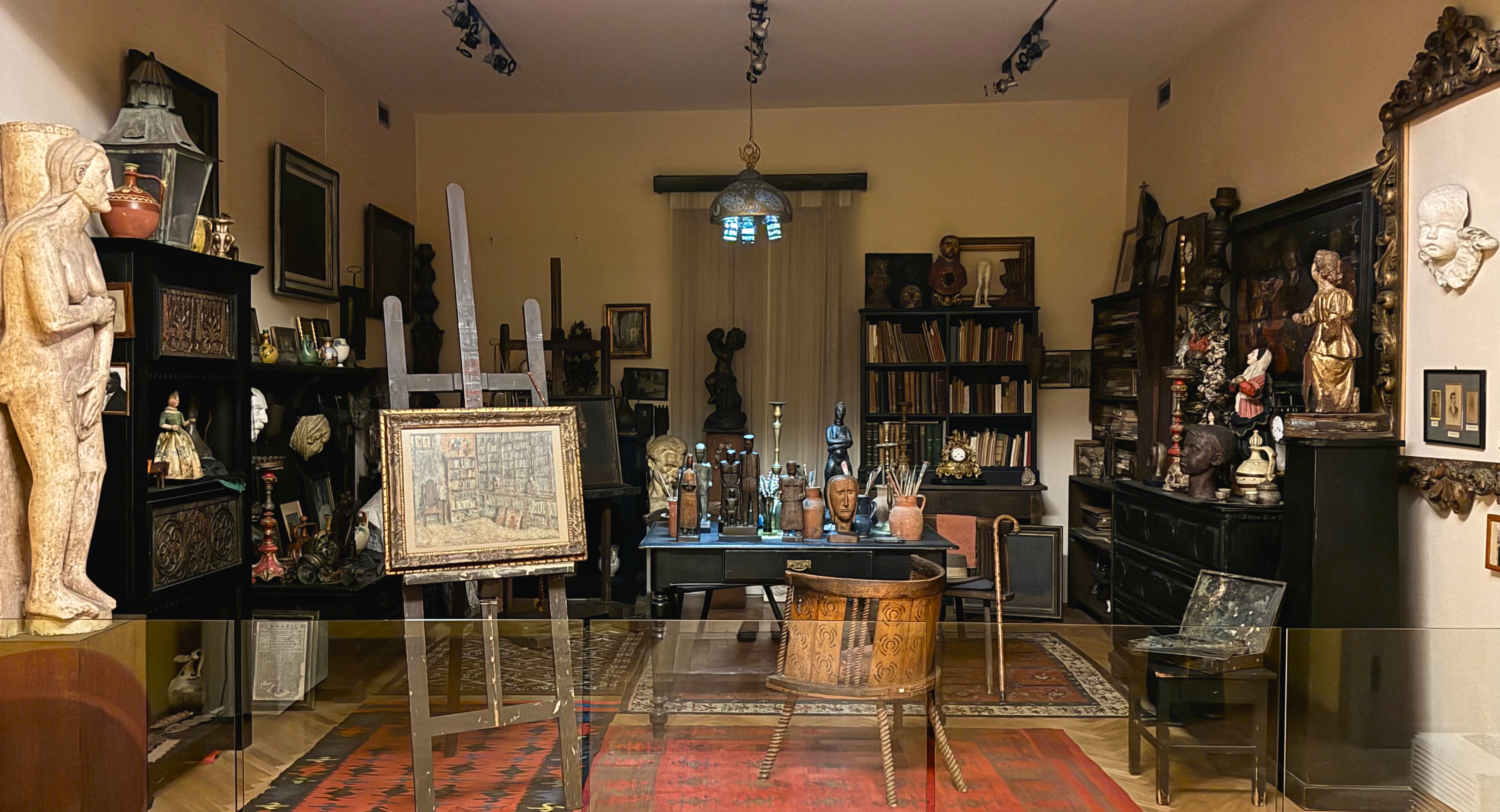 Emanuel Vidović studio reconstruction with paintings, books, and objects