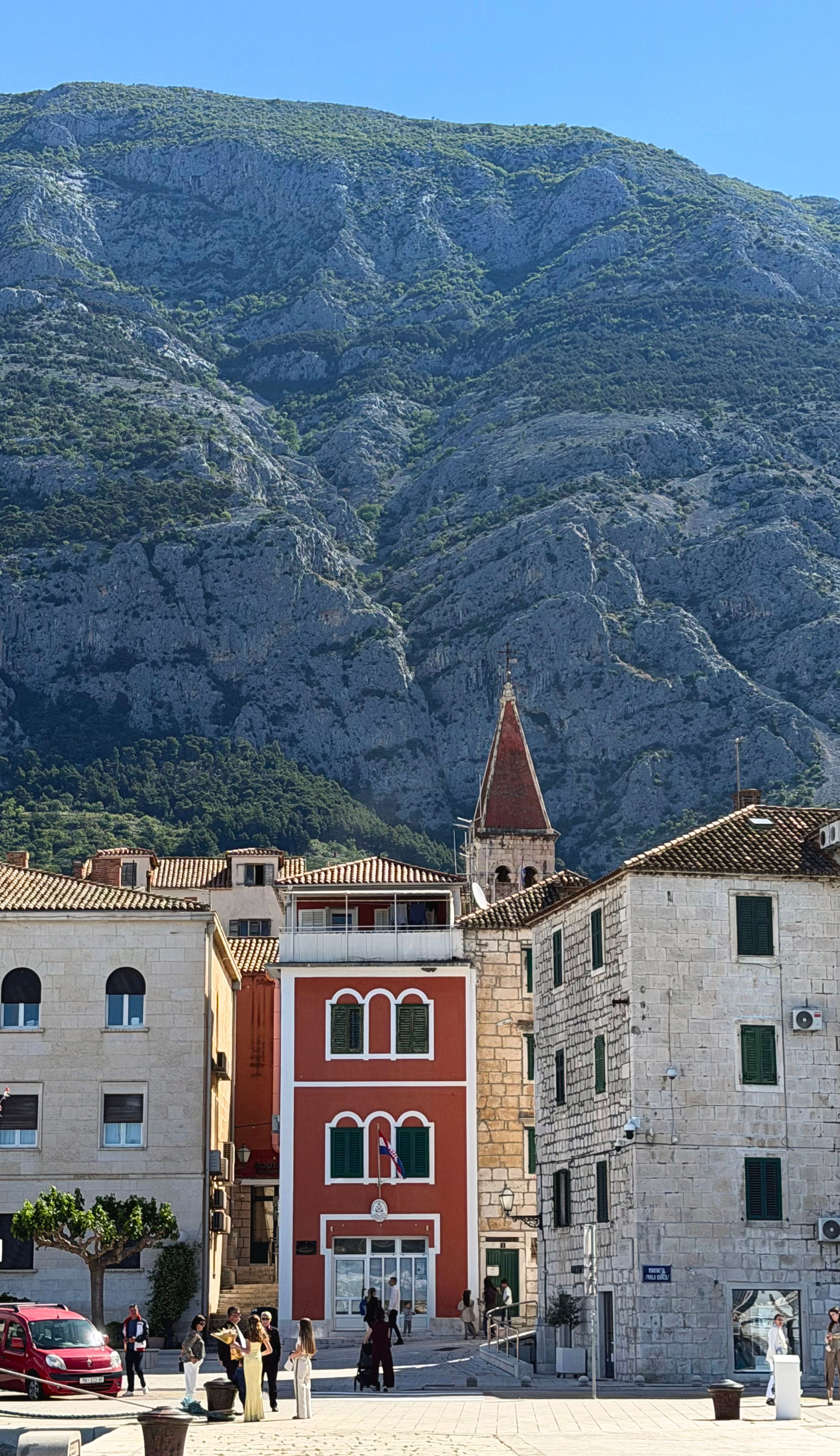 Makarska old town streets pressed below the Biokovo mountain wall