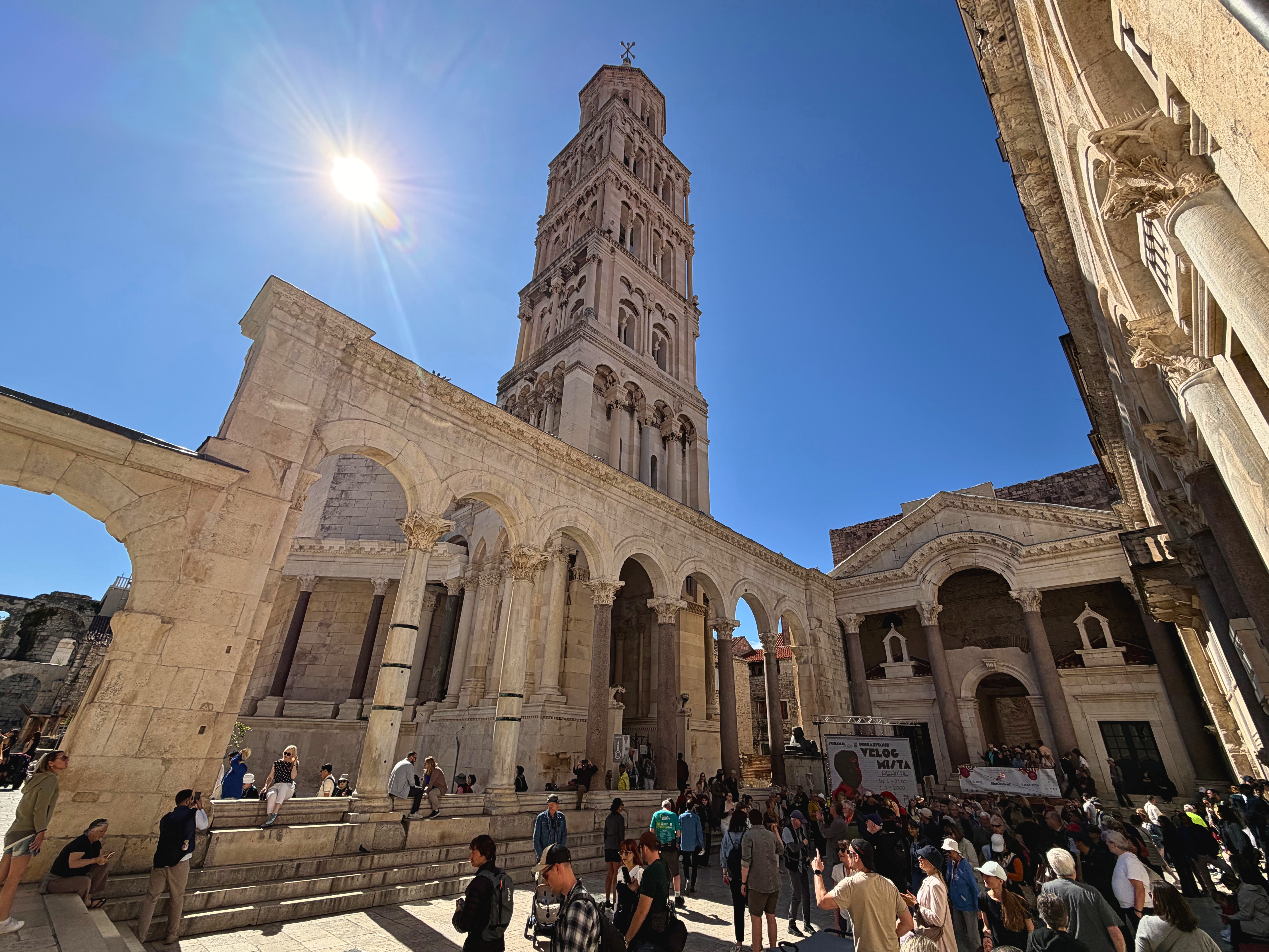 The Peristyle in Diocletian's Palace, with Roman columns, cathedral stone, and people gathered in the old center.