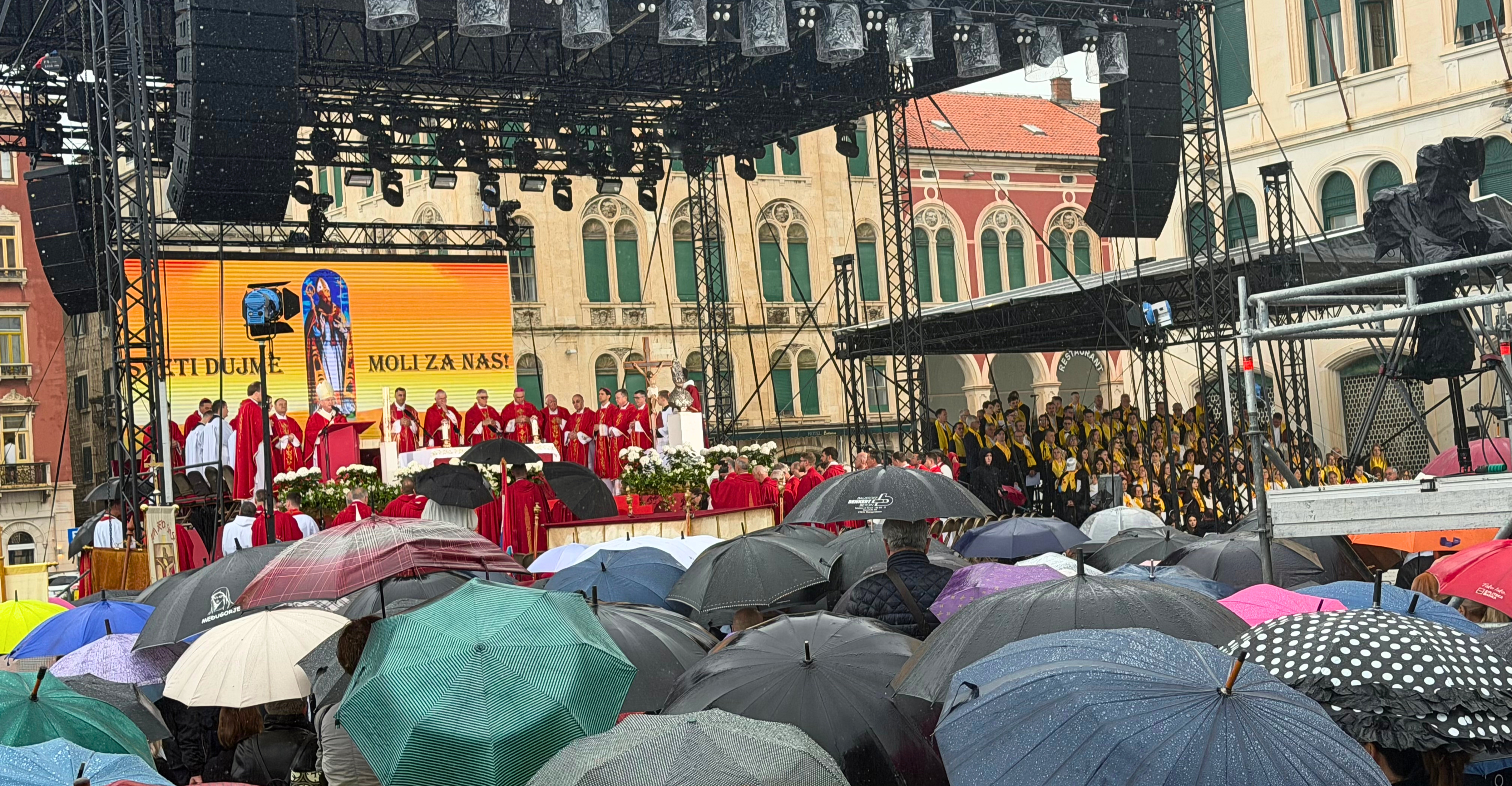 Umbrellas fill the Riva in Split during the Feast of Saint Domnius Mass.