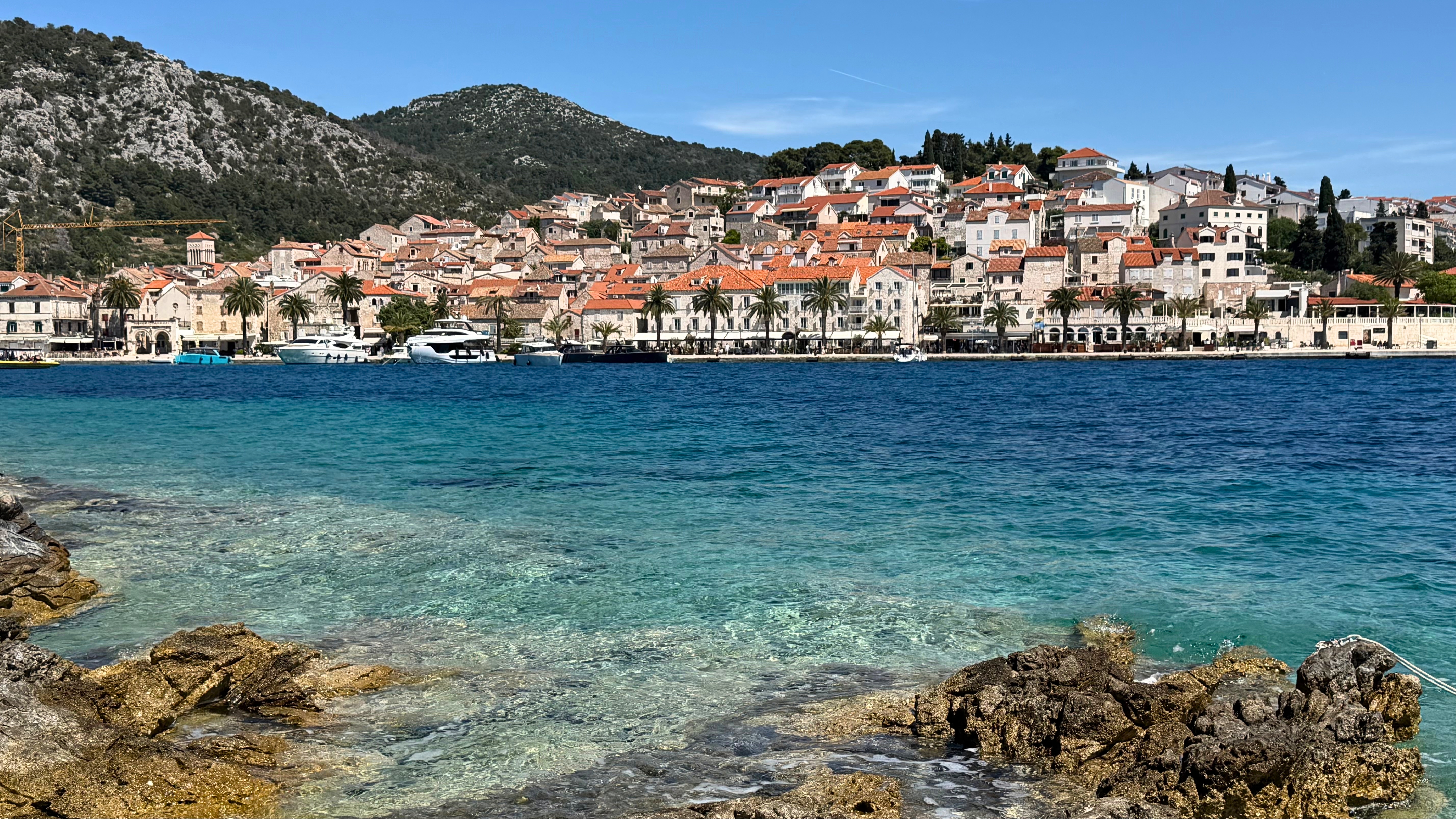 Hvar waterfront seen across clear Adriatic water after the crossing from Split