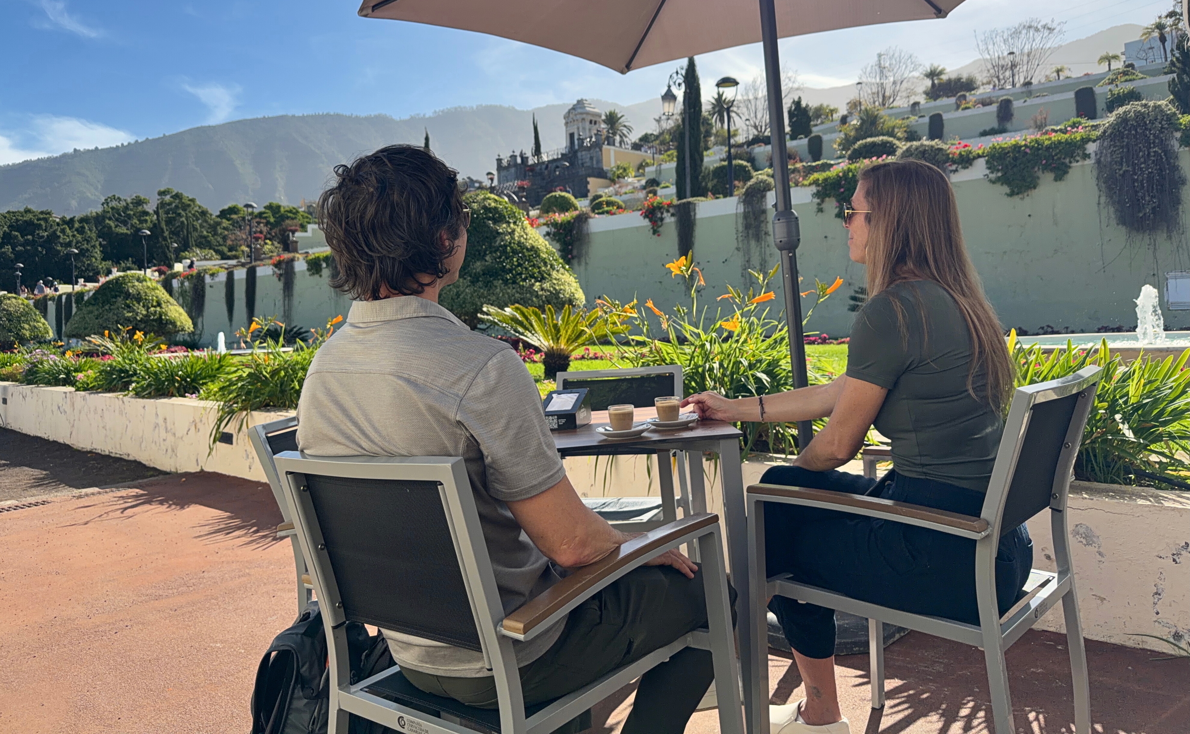 Sam and Stephanie seated with coffee in Victoria Gardens, La Orotava.