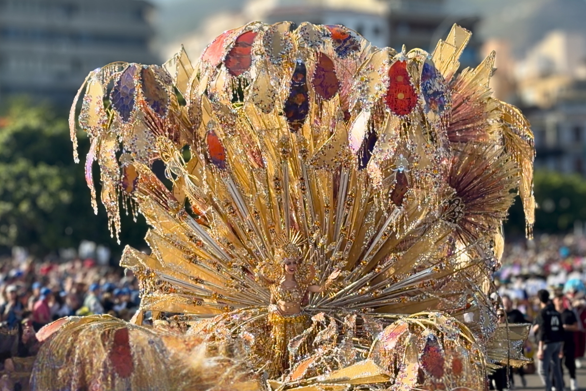 The Carnival Queen of Santa Cruz de Tenerife in a large gold costume during the Coso Apoteosis parade.