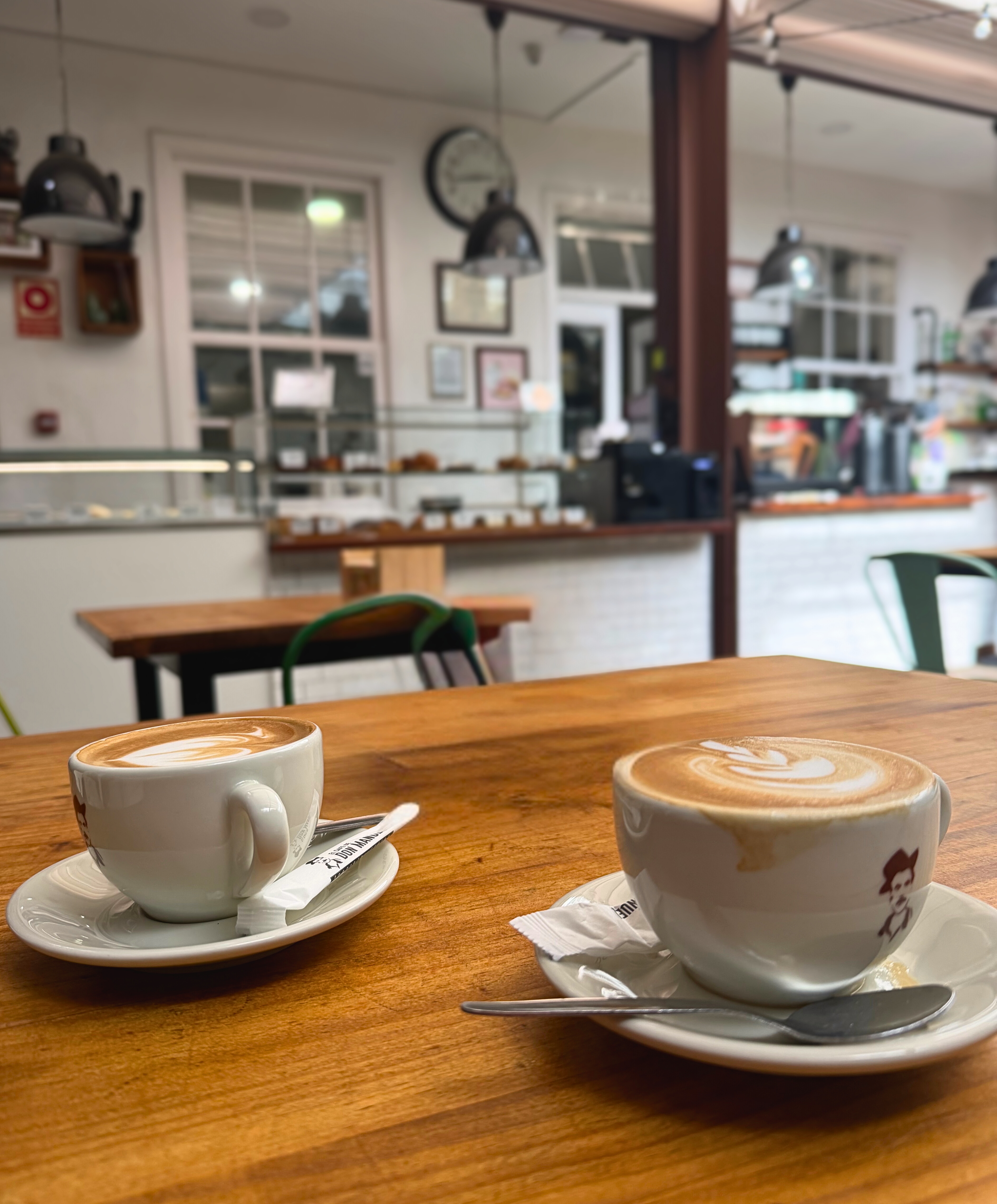 Coffee and small plates on a café table in Tenerife.