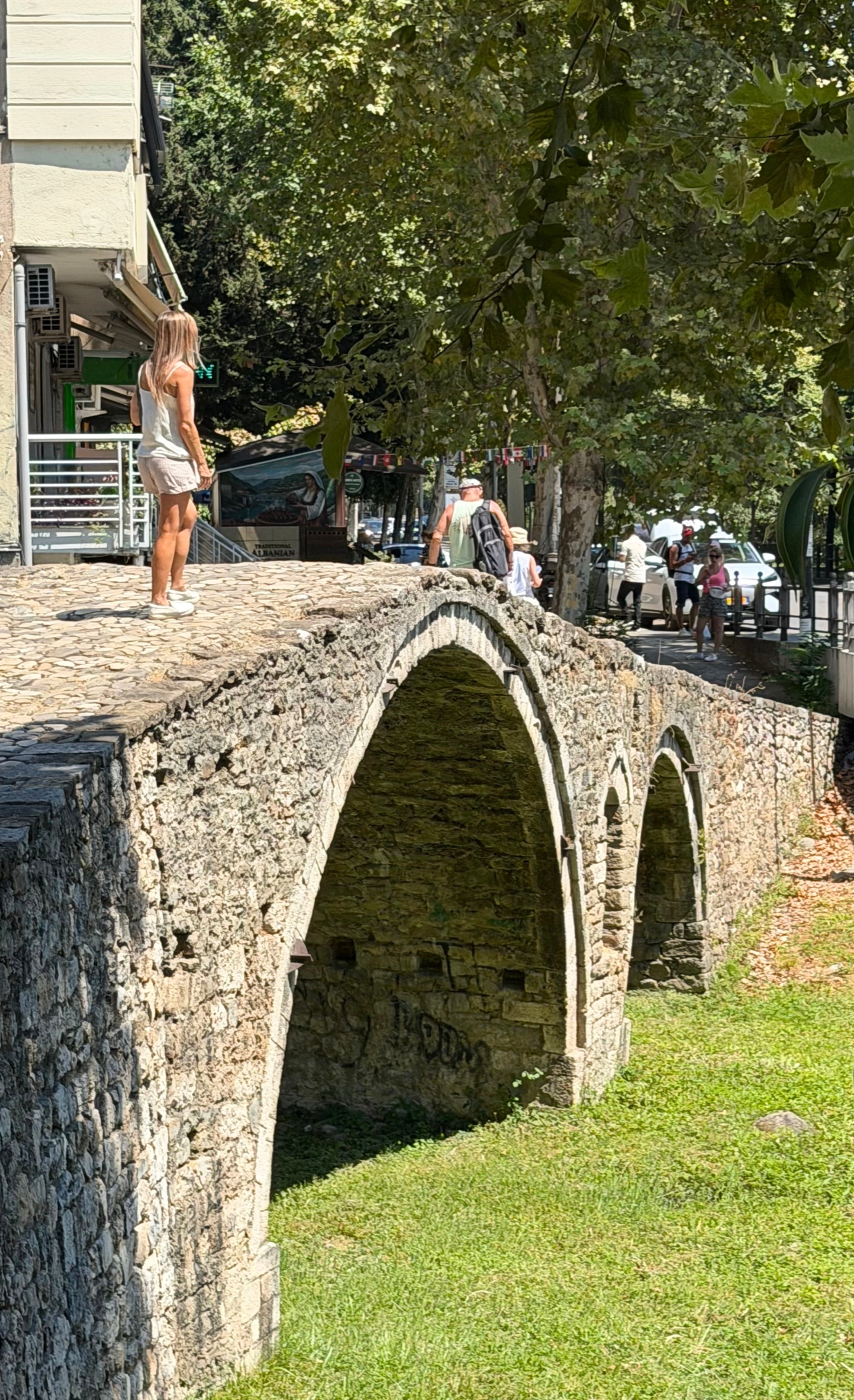 Tanner's Bridge in Tirana, an eighteenth-century Ottoman stone bridge beside modern roads and development.