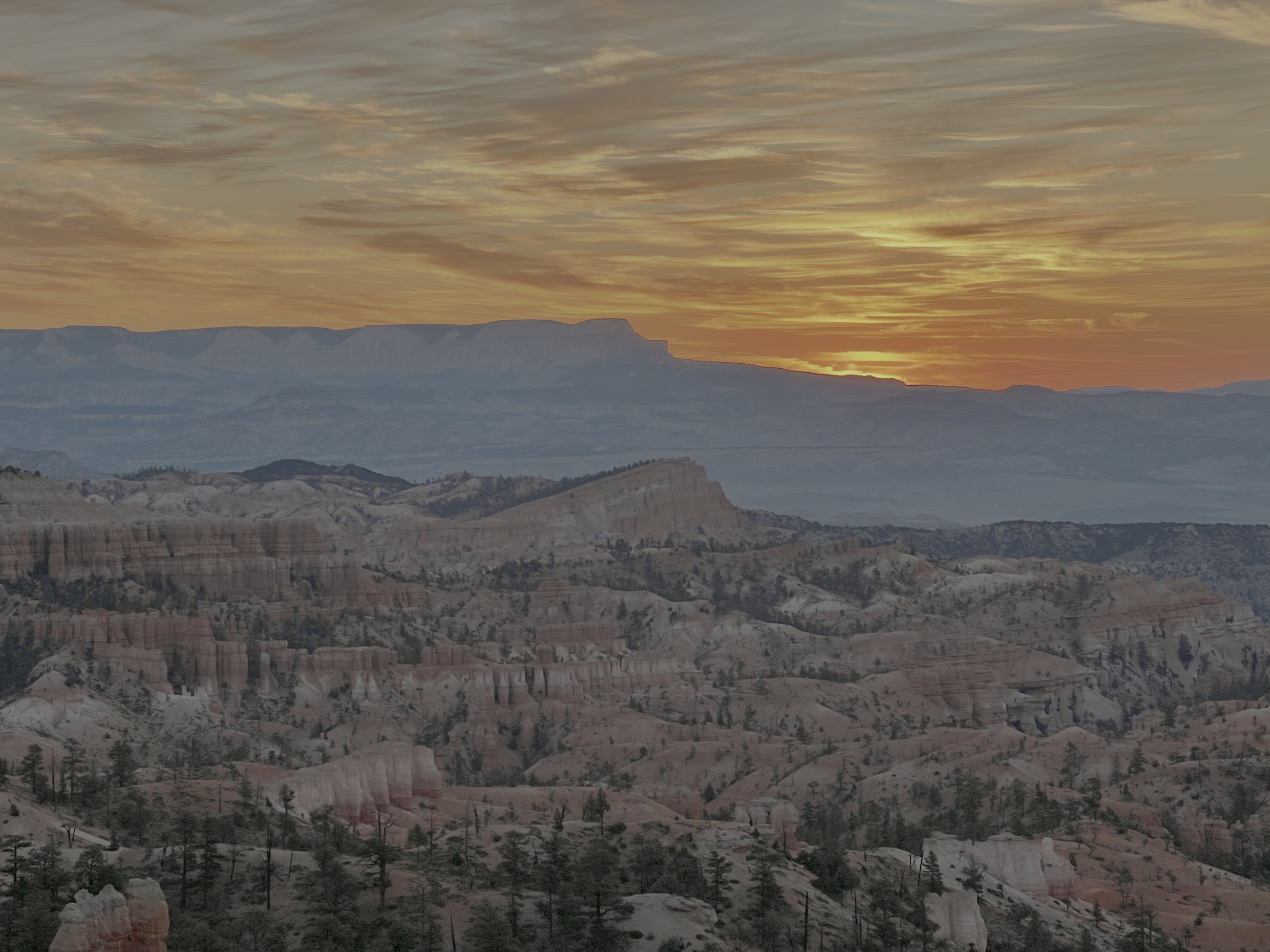 Sunrise light filling Bryce Canyon Amphitheater from Sunrise Point.