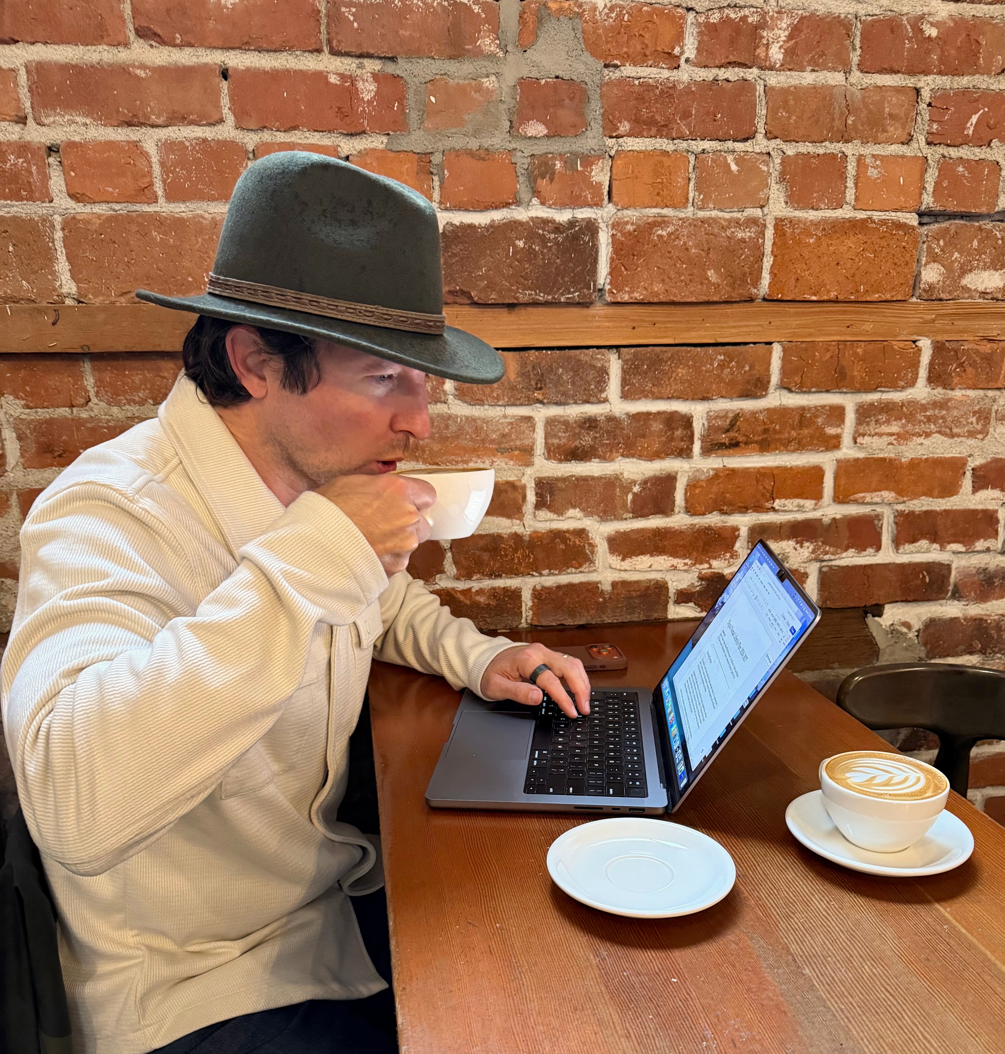 Coffee and rain outside the window at Scout Coffee in San Luis Obispo