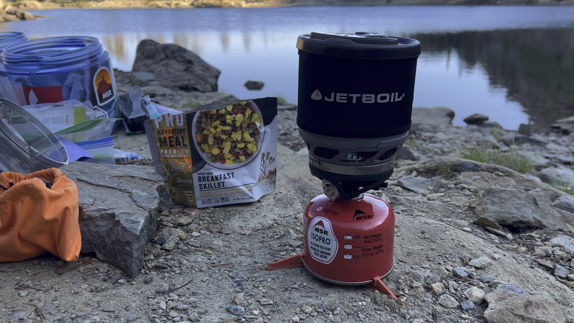A Jetboil stove and backpacking breakfast beside Rock Lake in California's Lakes Basin.