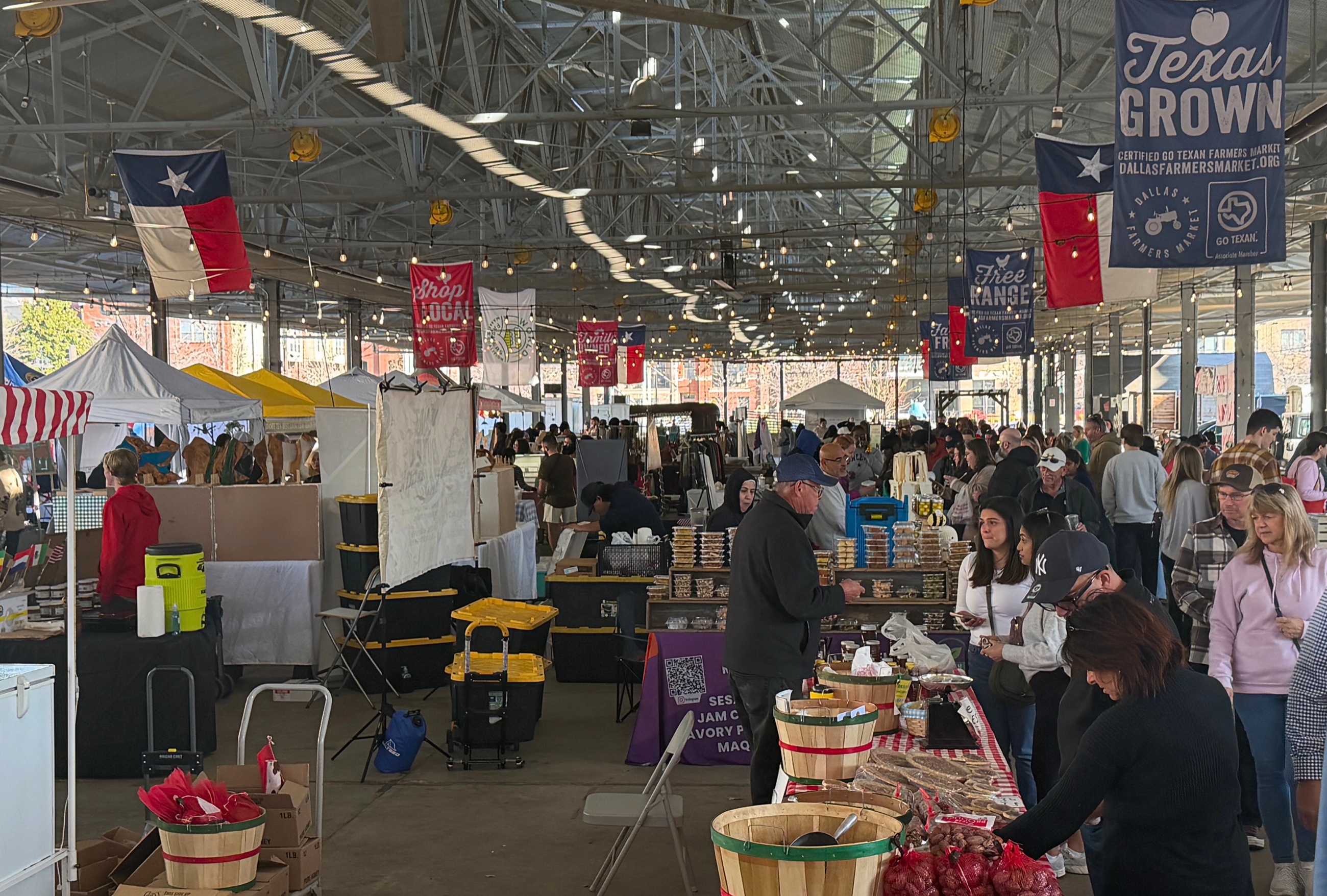 Vegetable displays and vendor stalls at Dallas Farmers Market.