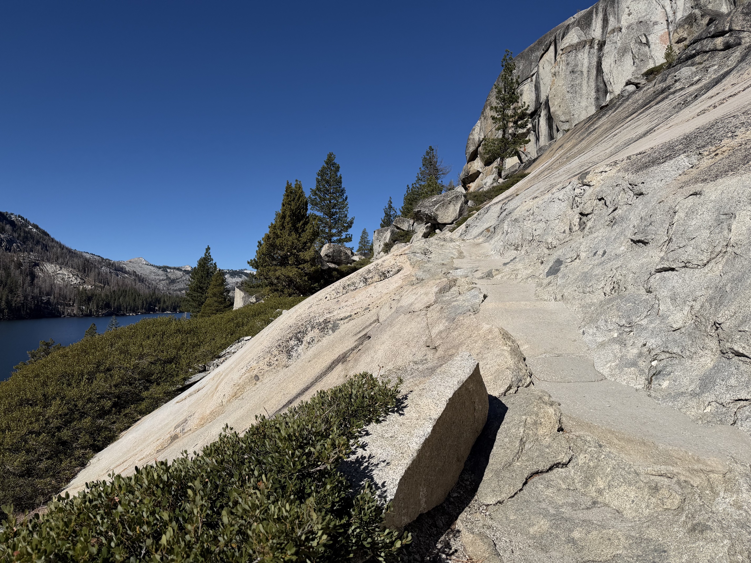 The Pacific Crest Trail crossing an exposed rock slope above Echo Lakes.