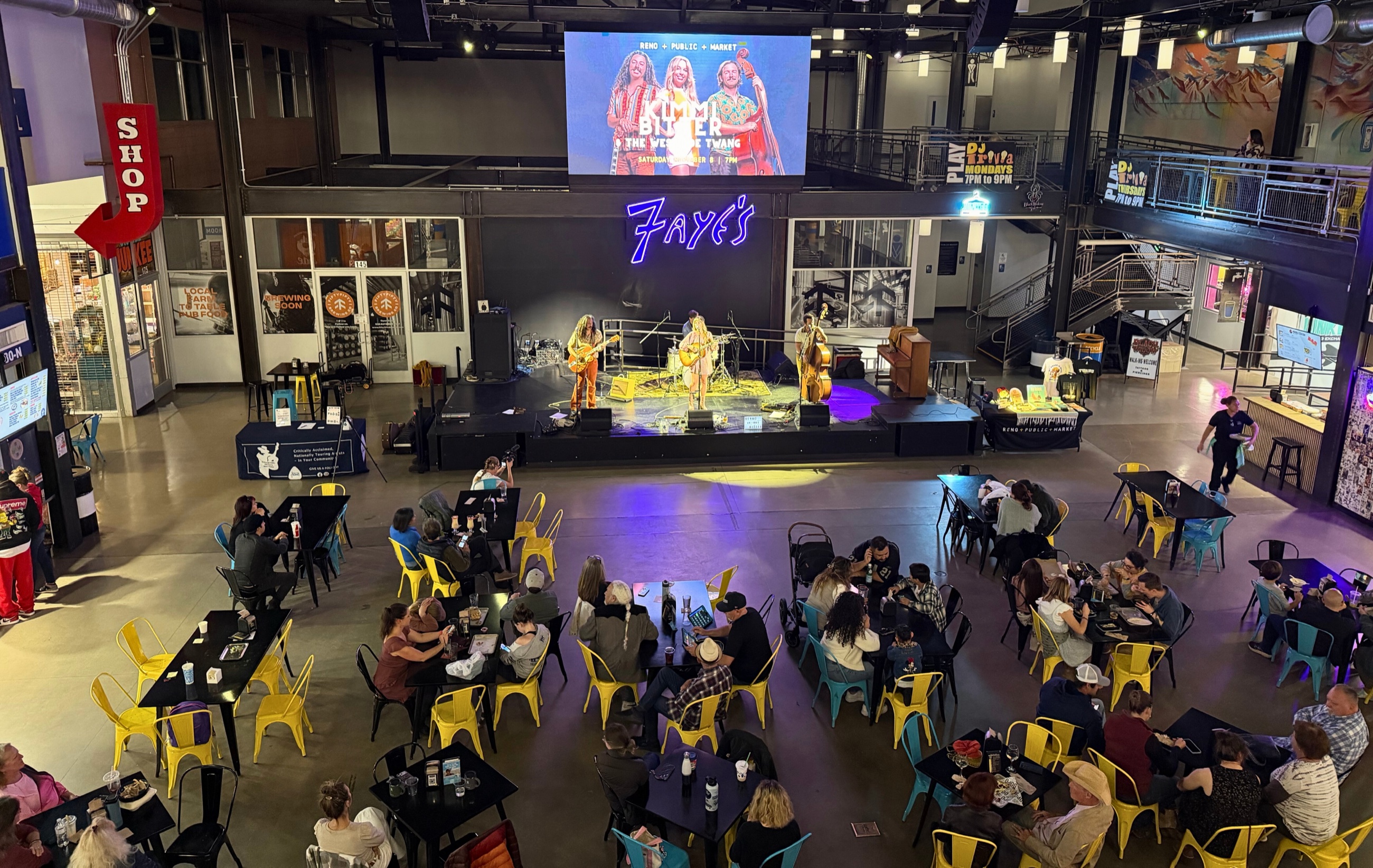 A wide view of Reno Public Market during a live performance