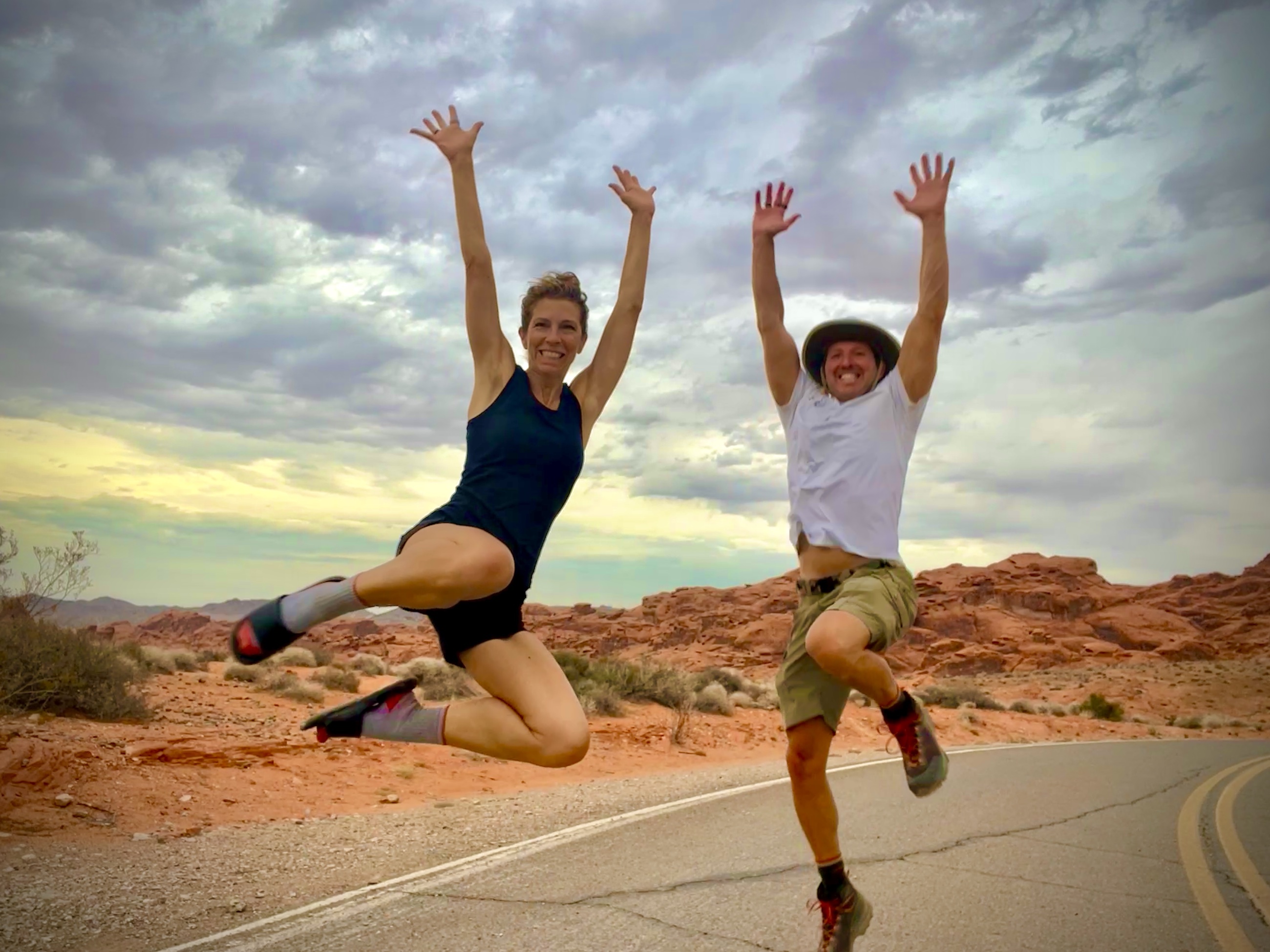 Sam and Stephanie standing among red sandstone in Valley of Fire State Park.