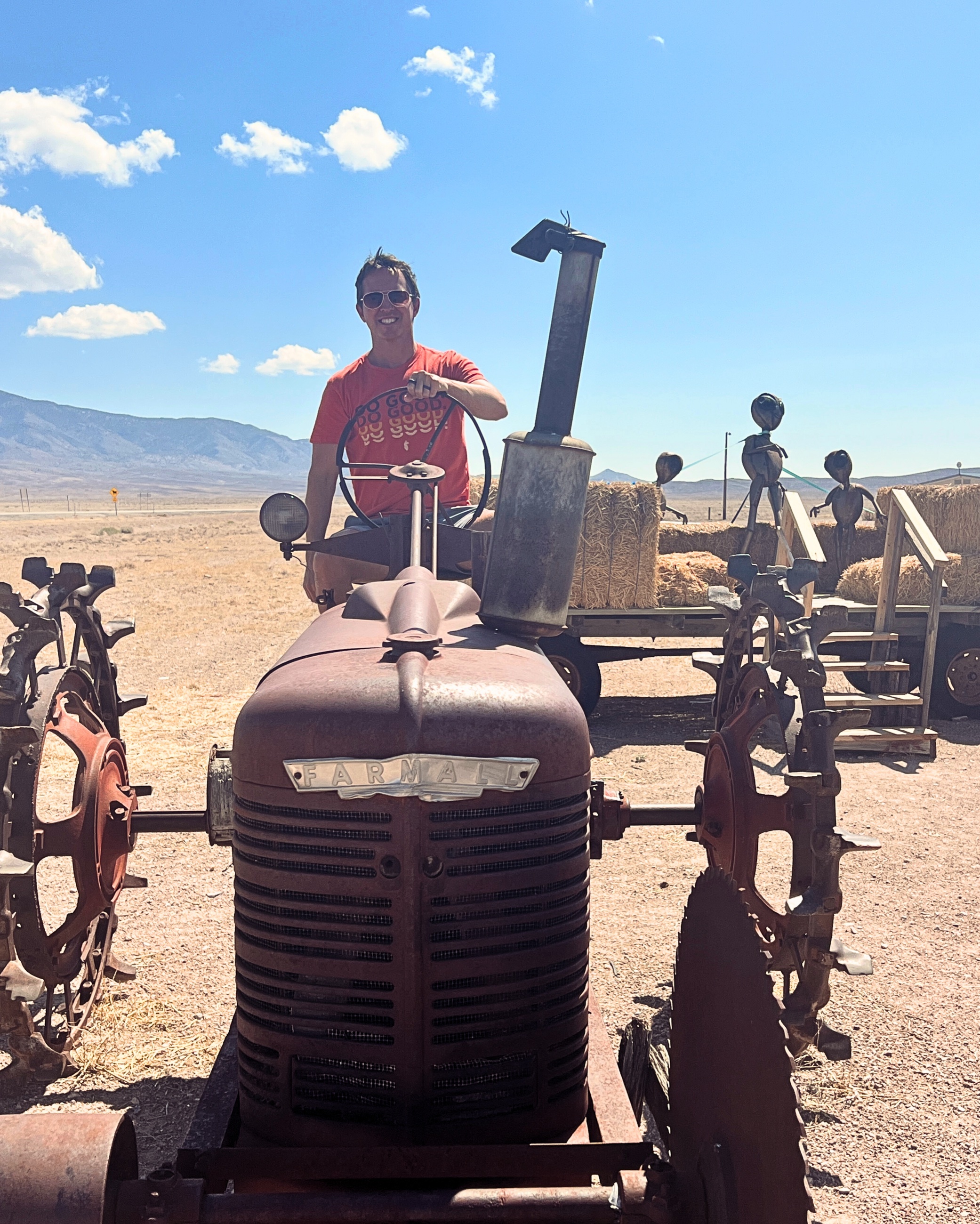 Sam standing beside an Area 51 themed roadside sign in rural Nevada.