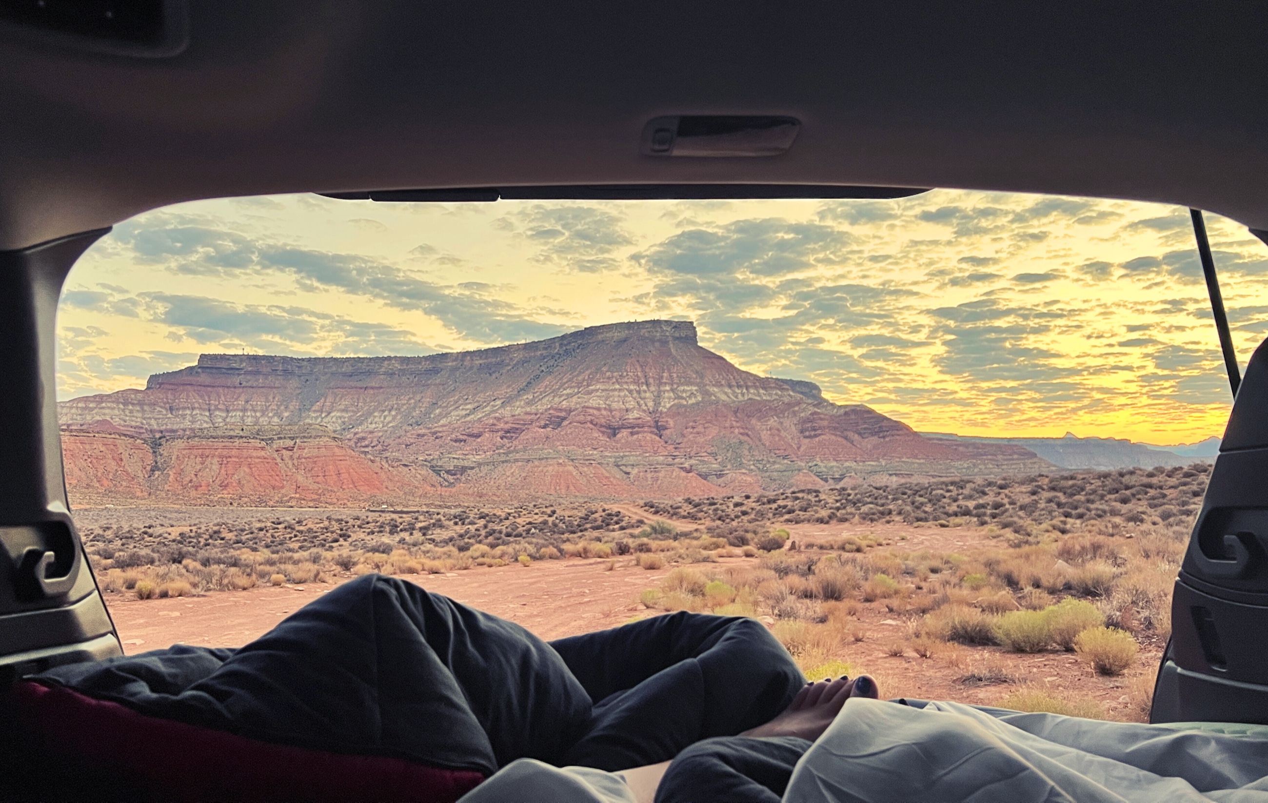 Sunrise over the desert from a campsite near Hurricane Cliffs outside Zion National Park.